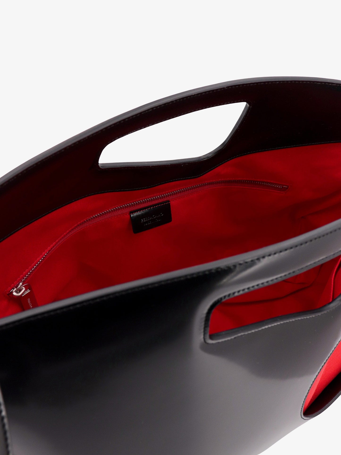 Leather and canvas handbag with cut-out details