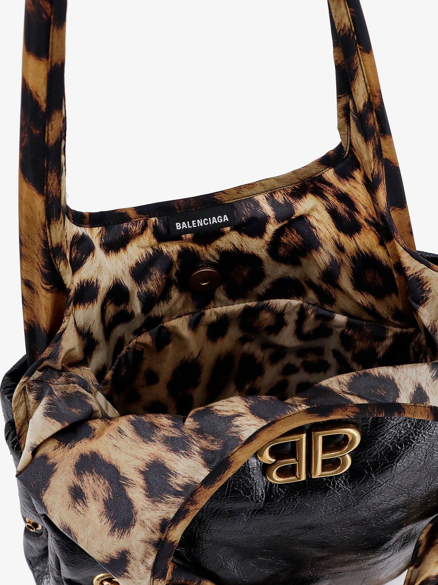 Changeable leather shoulder bag with animalier insert