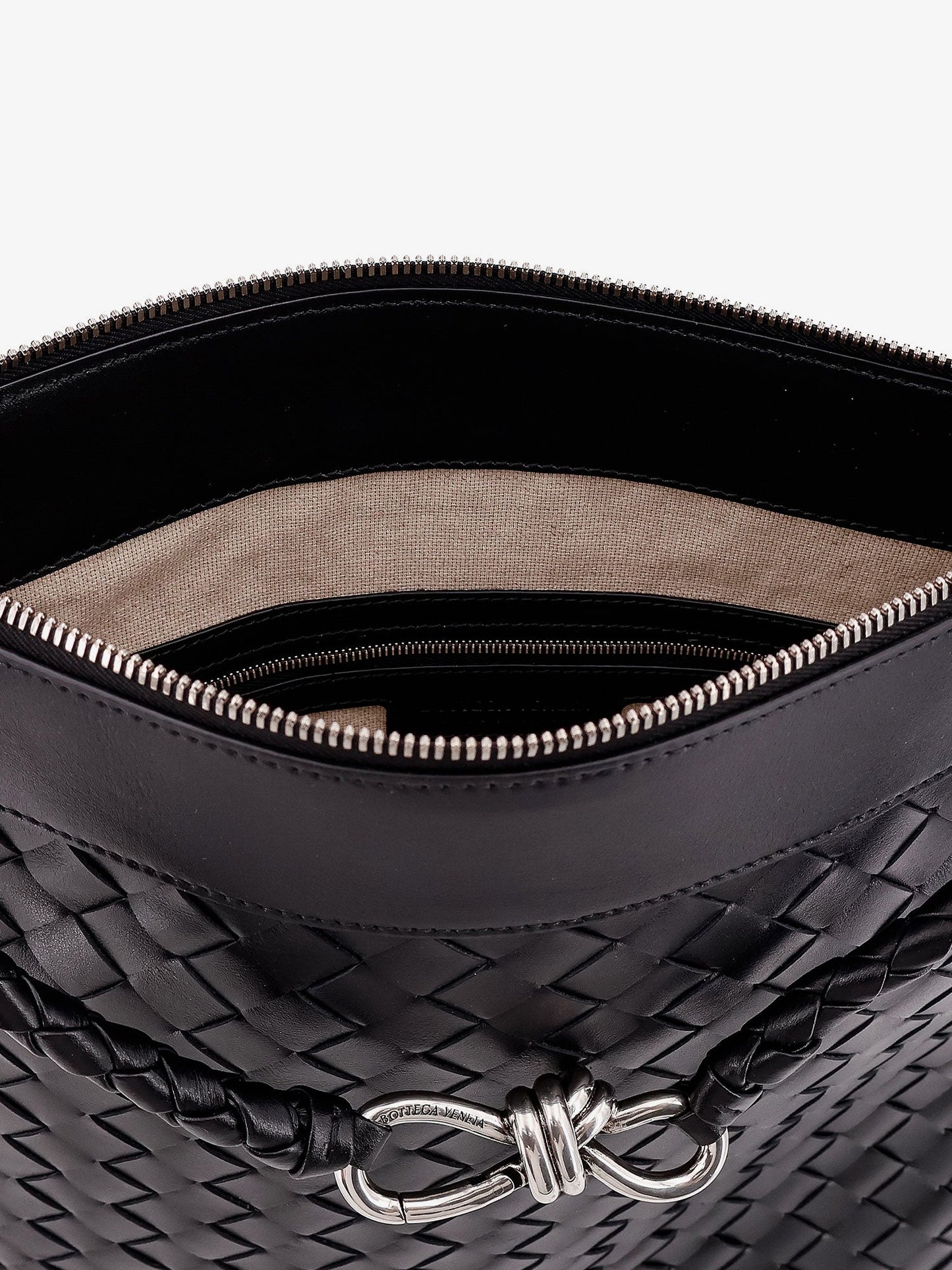 Shoulder bag with woven motif, zip closure and leather shoulder strap with metal knot detail