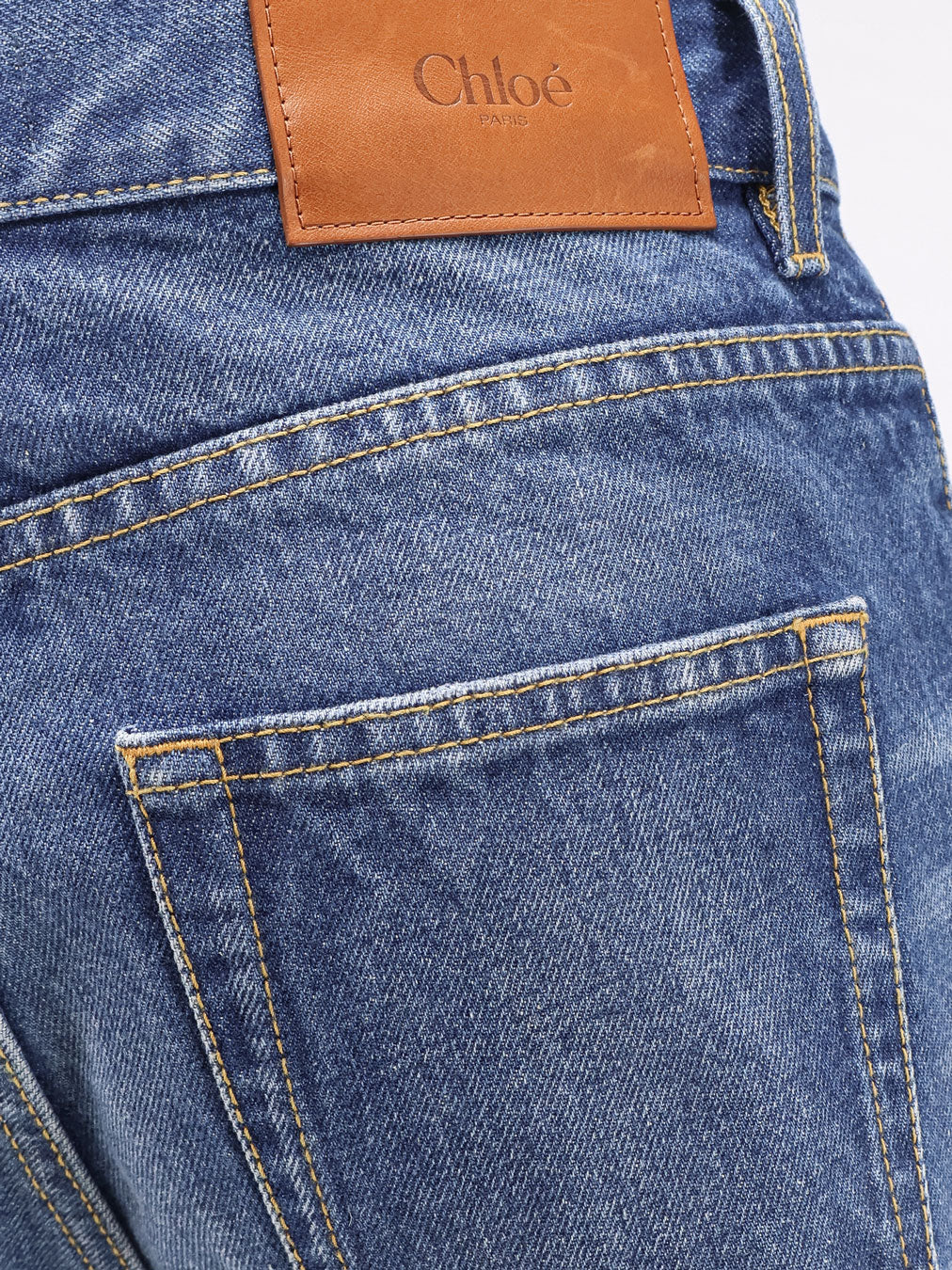 Jeans with leather logo tag