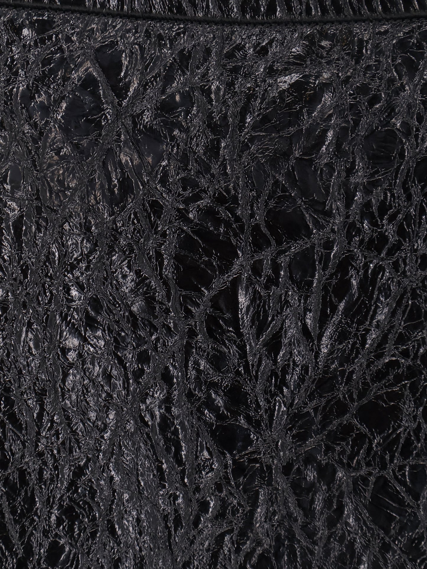 Shiny leather and neoprene skirt