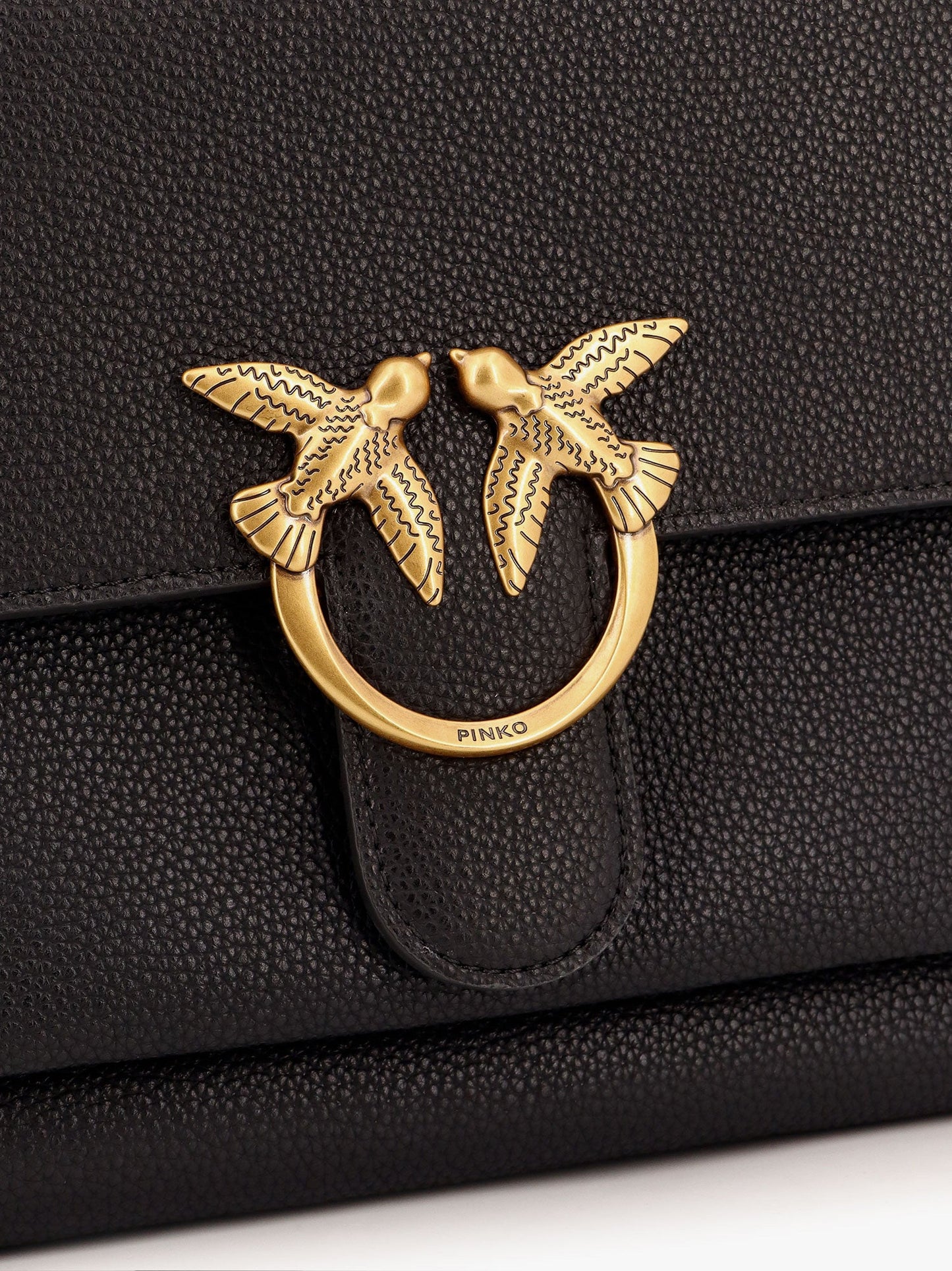 Leather shoulder bag with metal love birds buckle