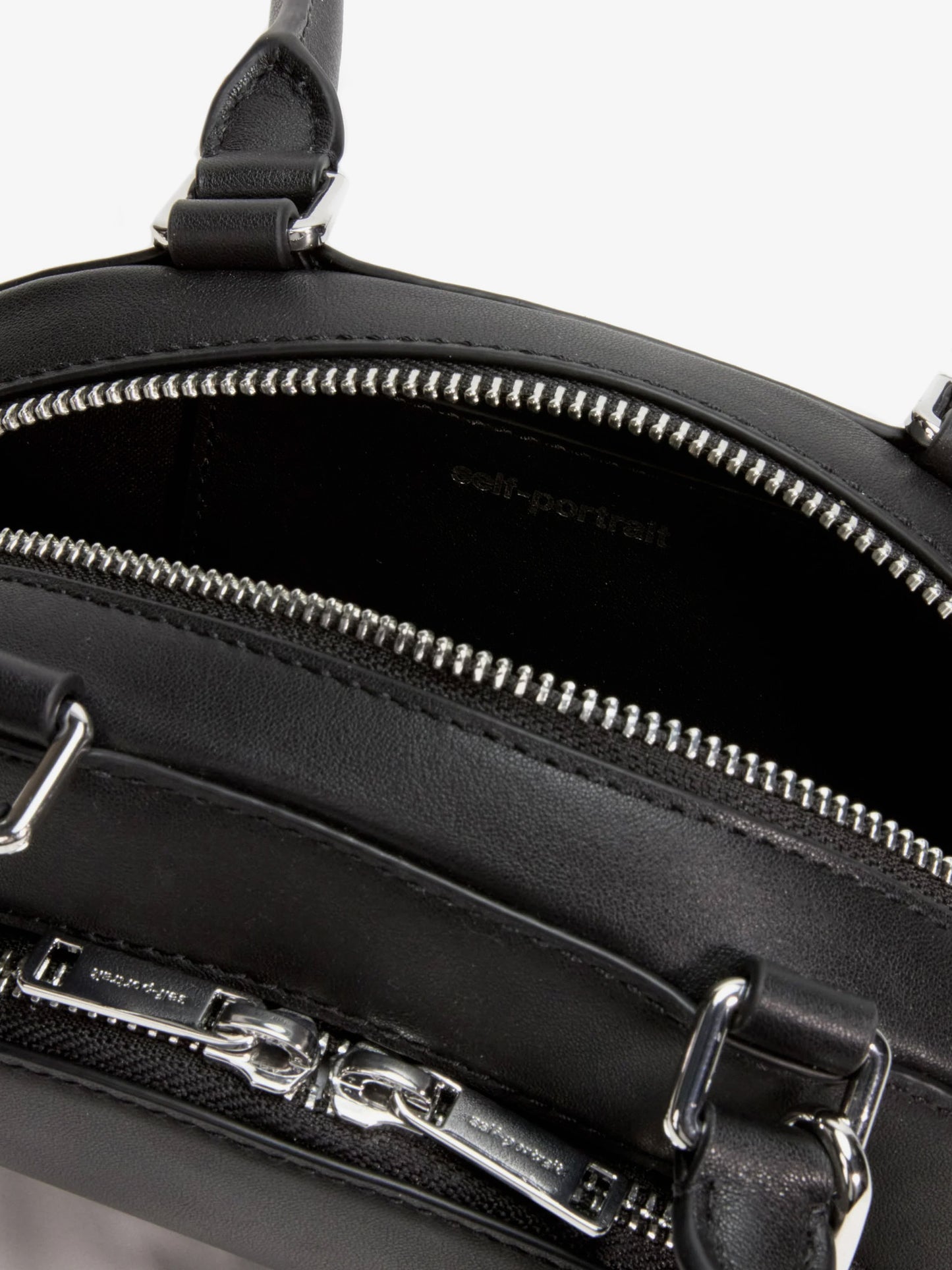 Leather shoulder bag with charms