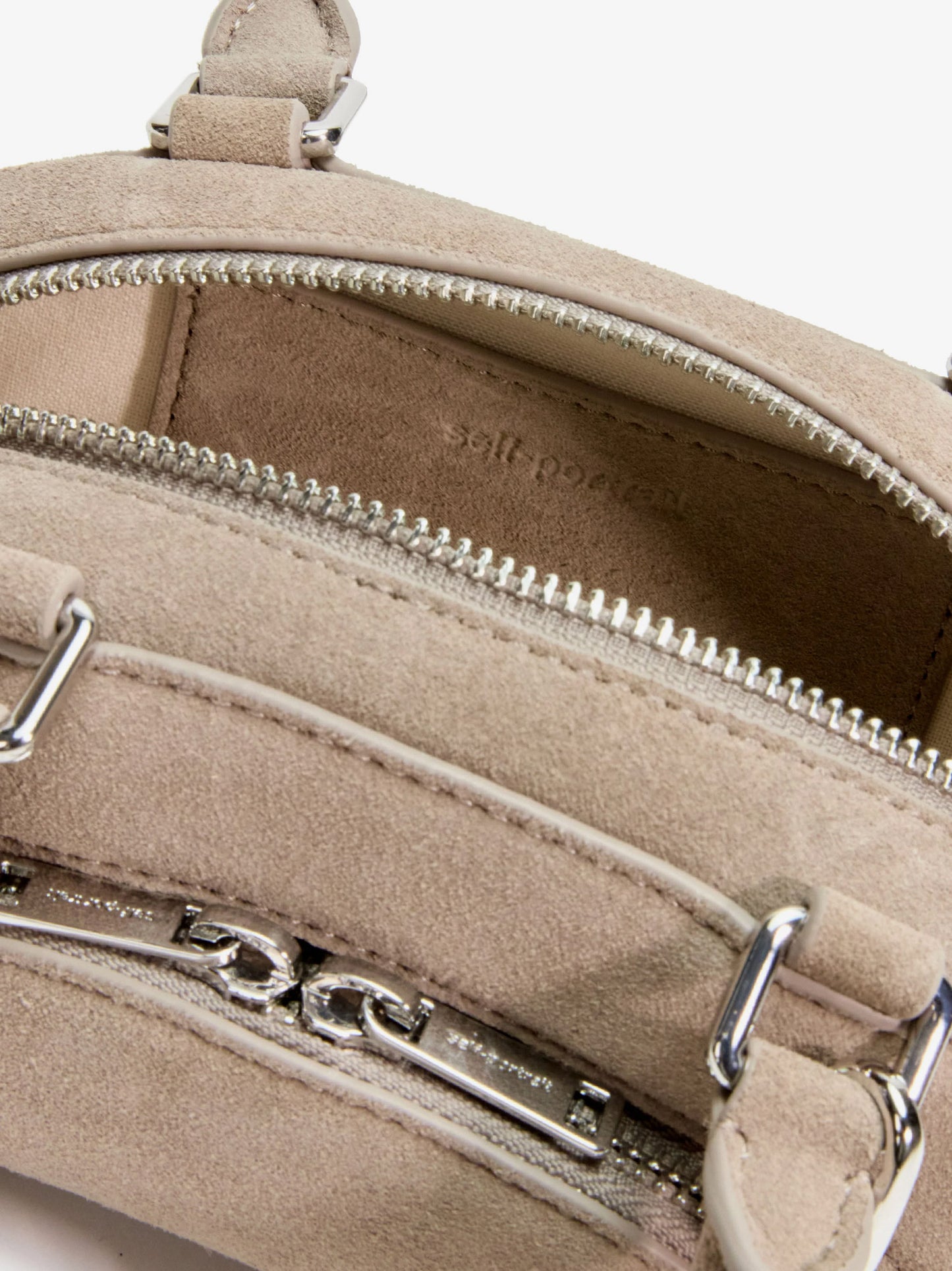 Suede shoulder bag with charms