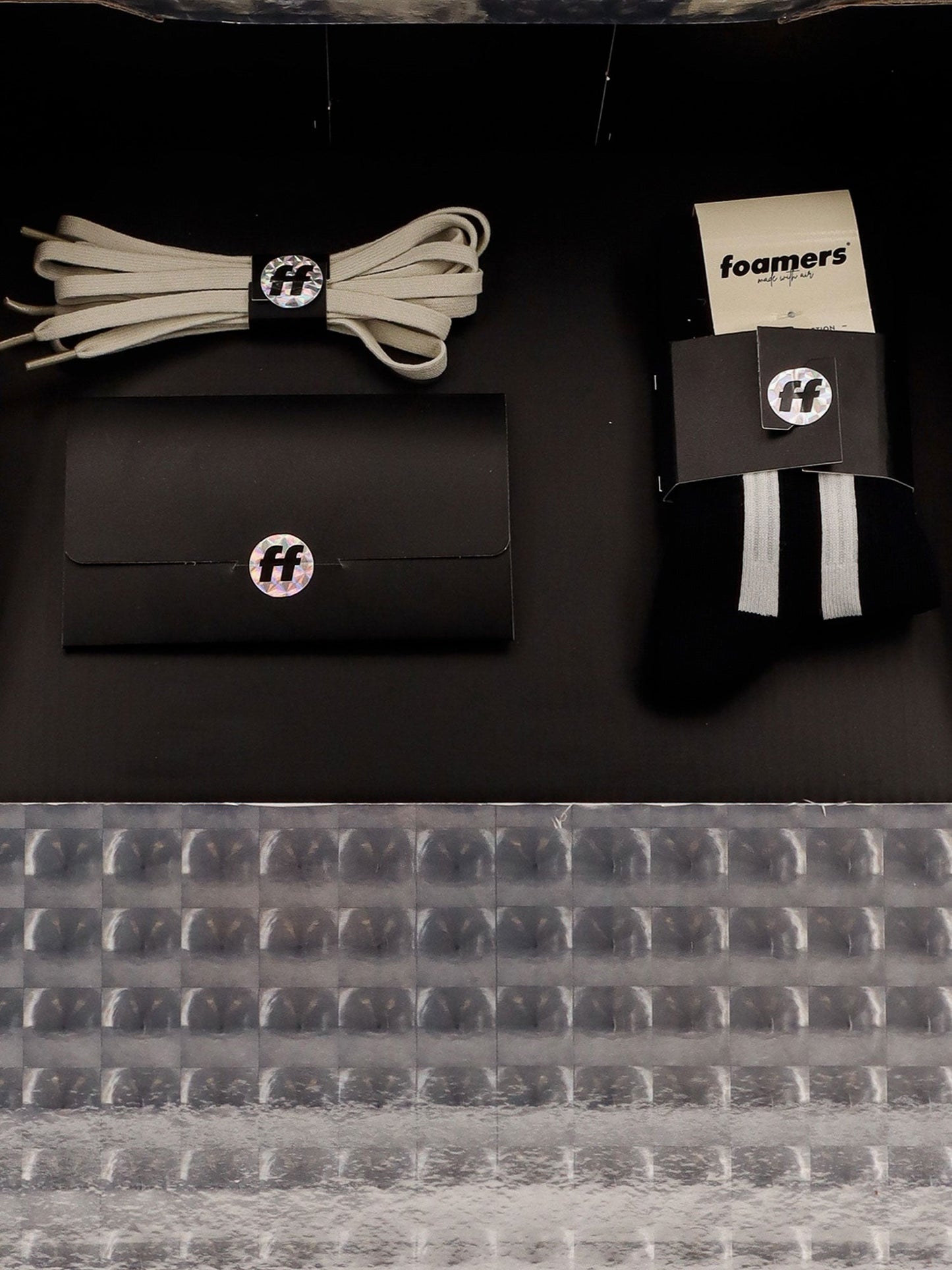 Low-top sneakers realized with foam with lateral openwork