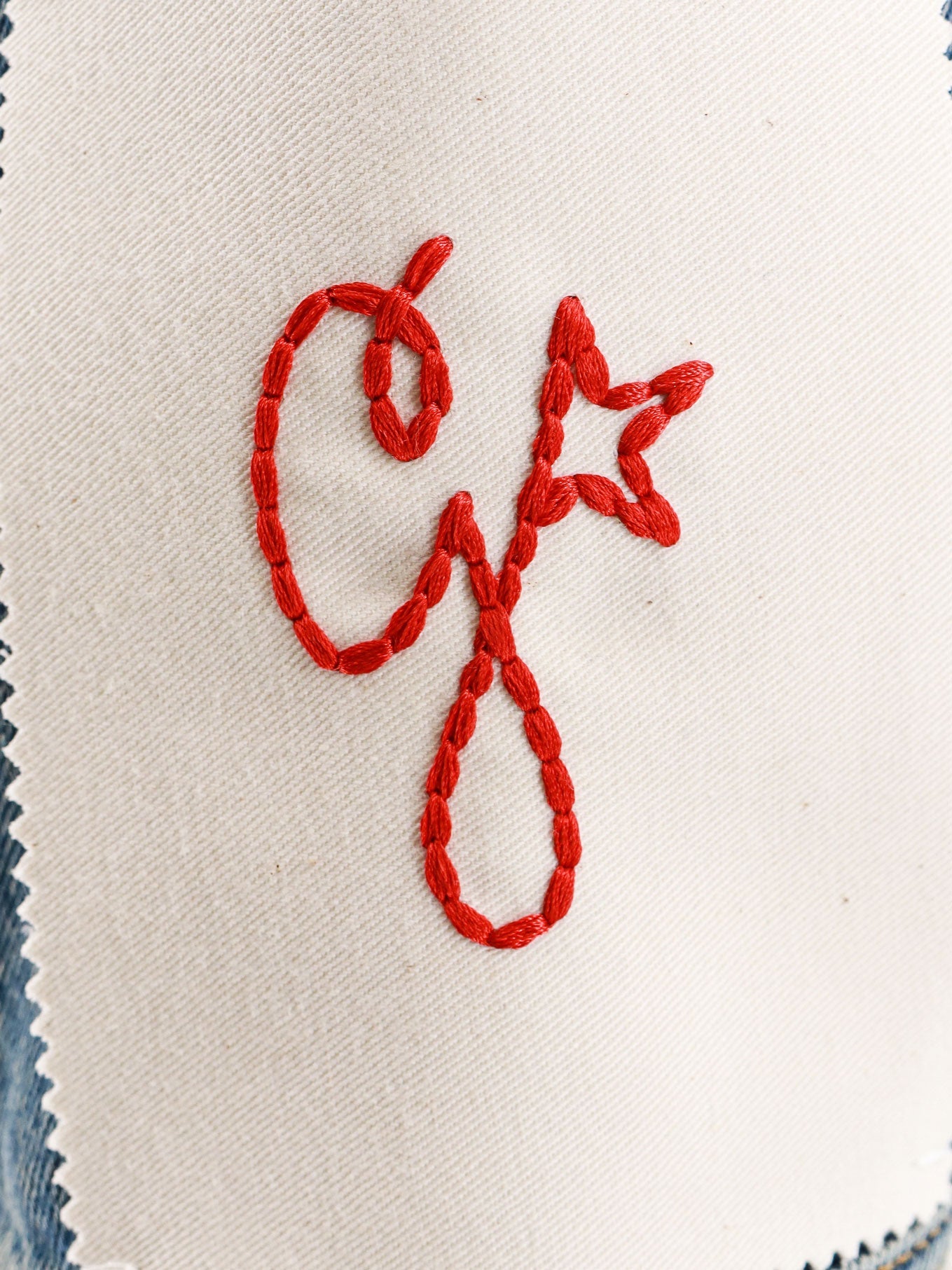 Denim jacket with embroidered monogram