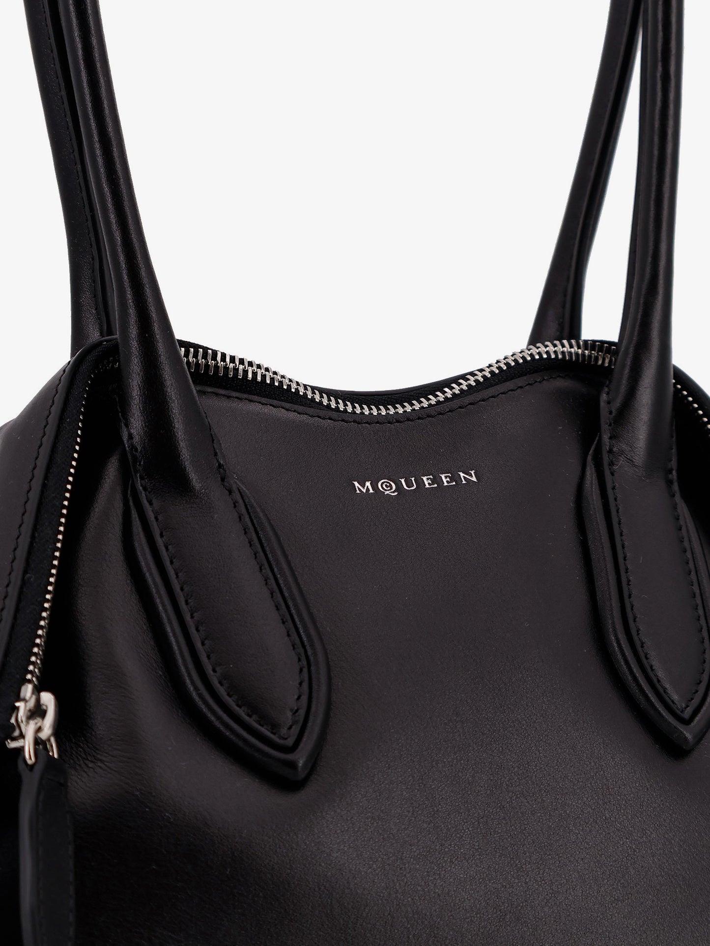 Manta leather shoulder bag with all-over metal details