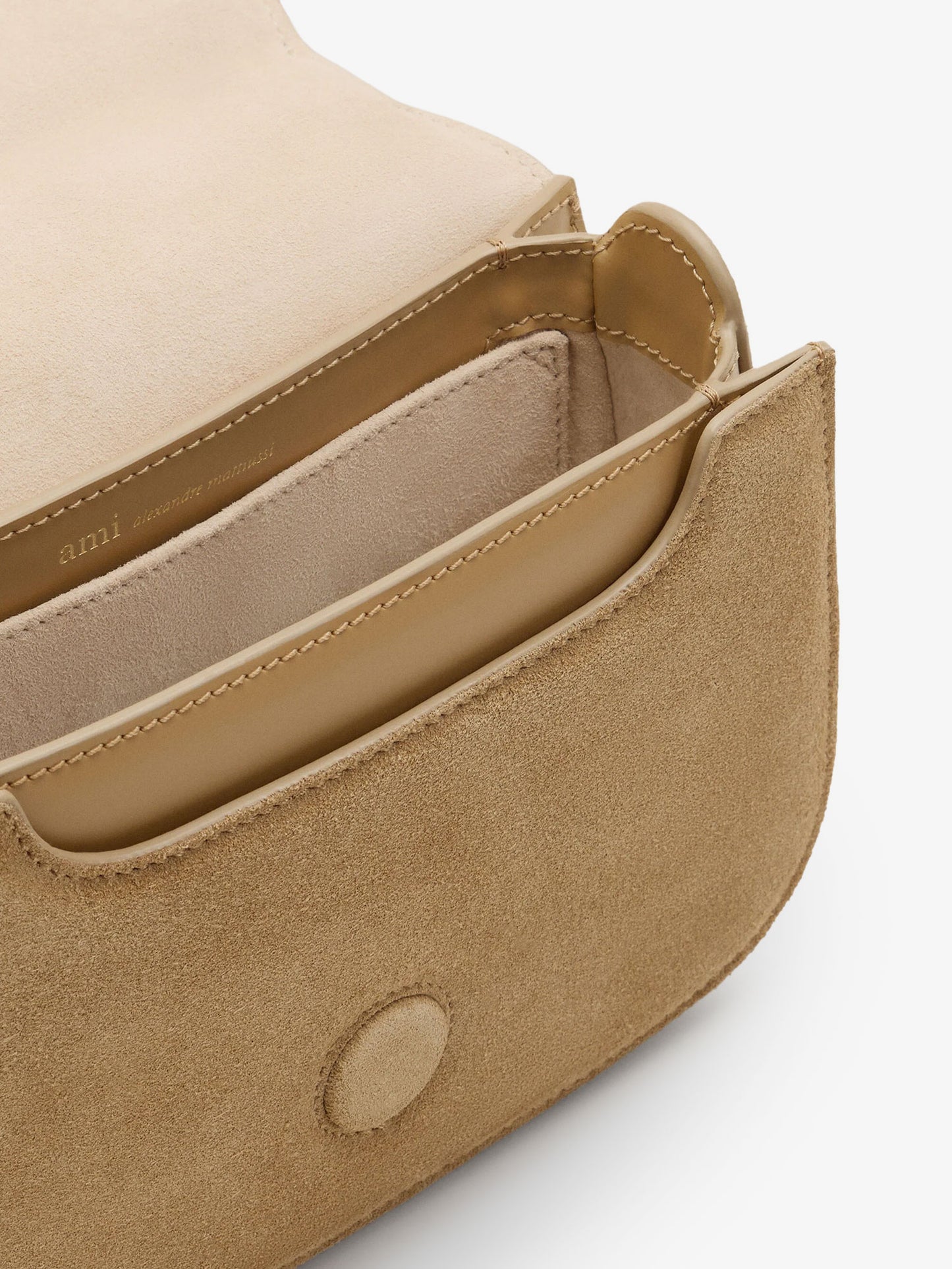 Suede crossbody bag with metal logo on the front