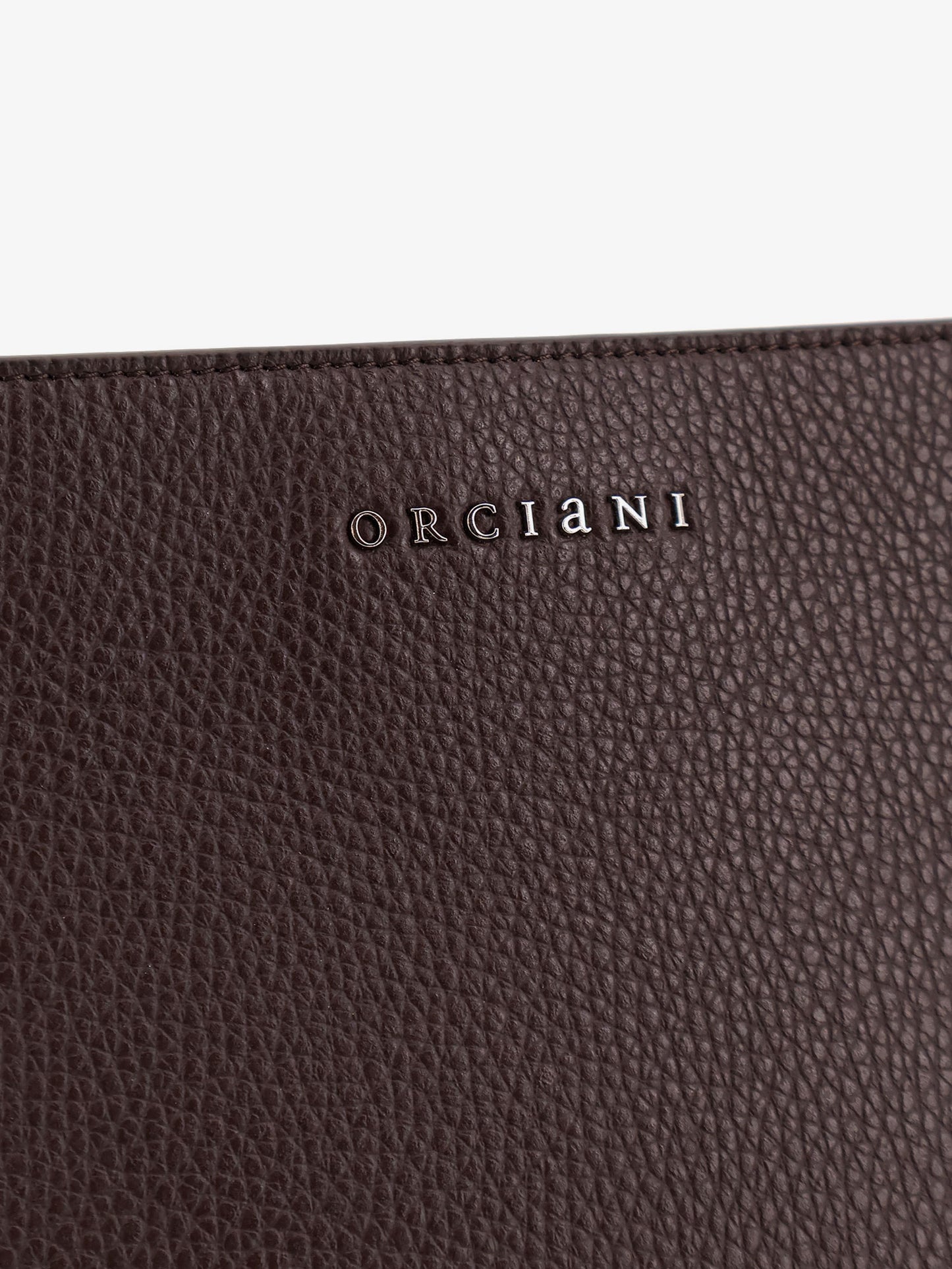 Hammered leather clutch with logo on the front