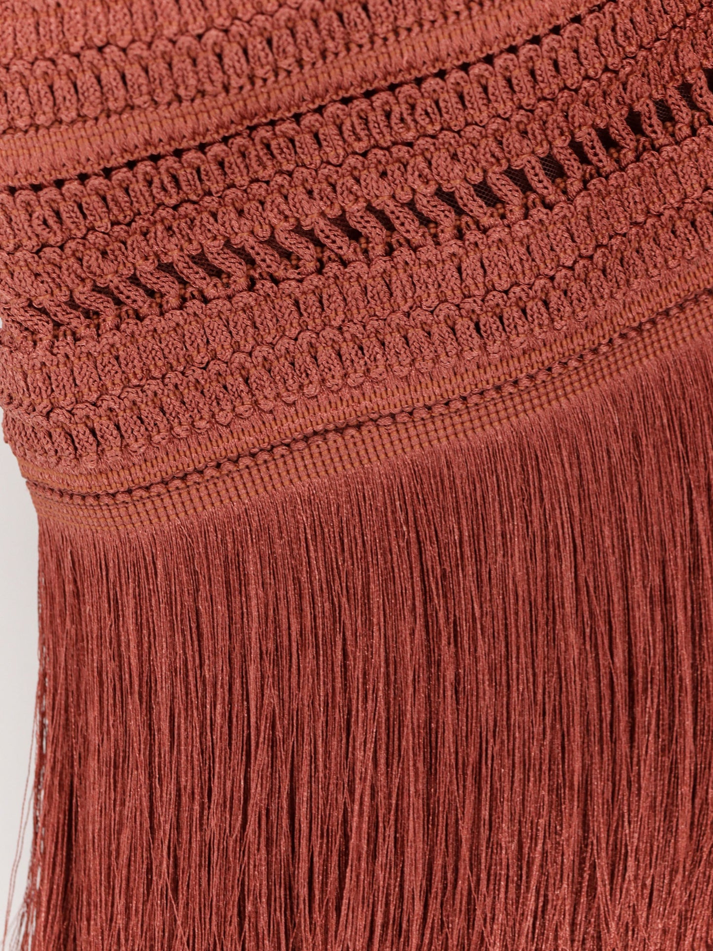 Asymmetrical top with fringes