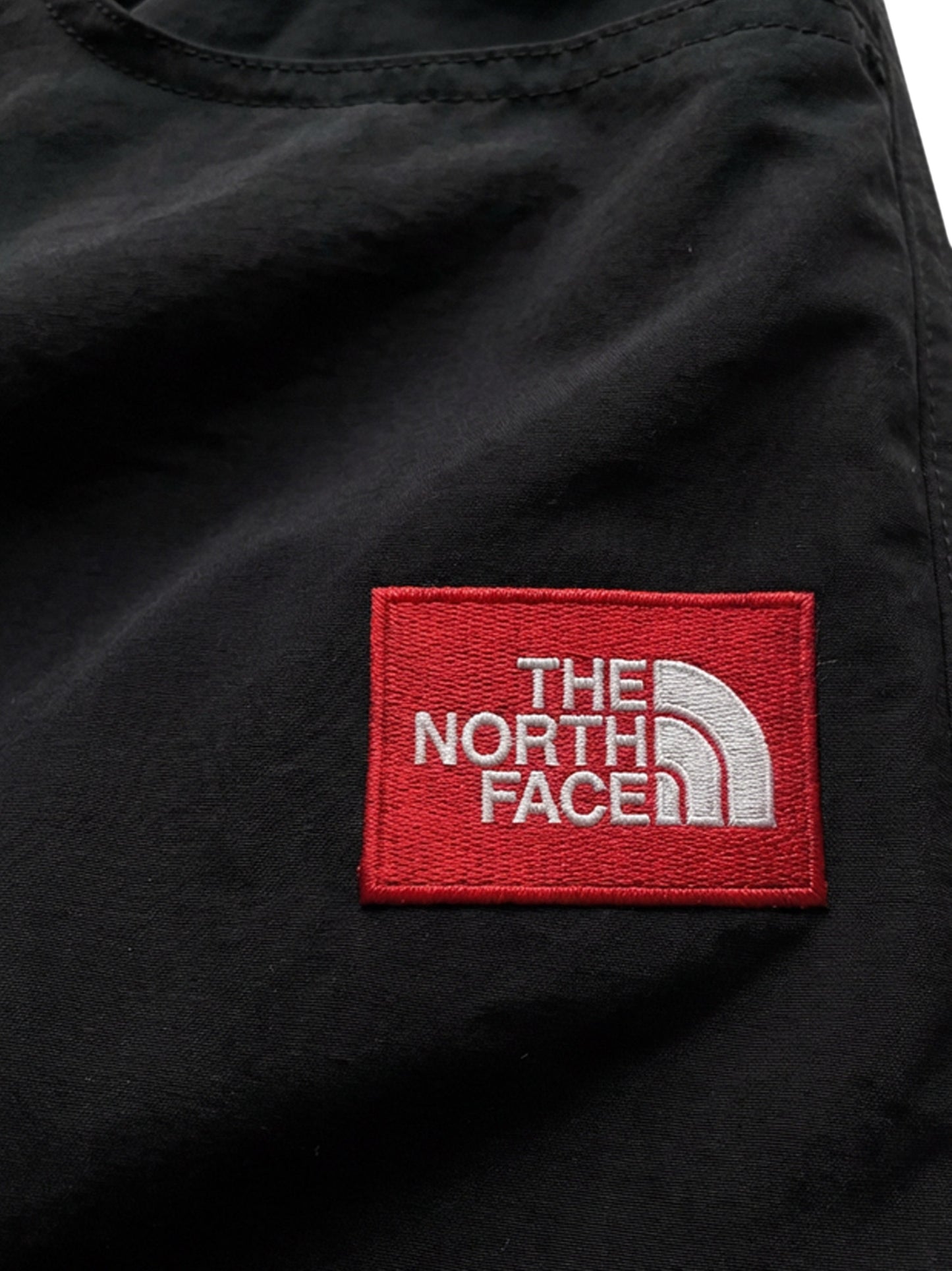 Nylon trousers with front logo patch
