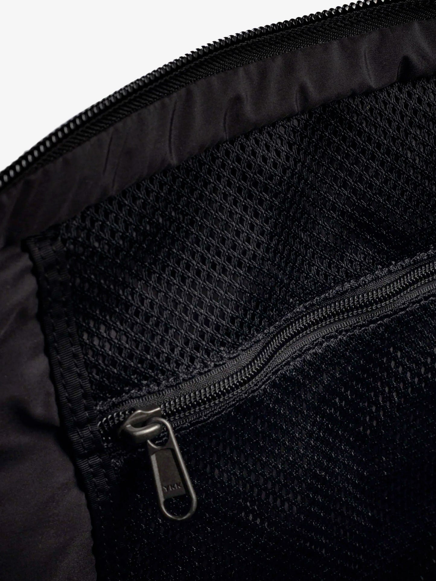 Nylon shoulder bag with logo label on the bottom