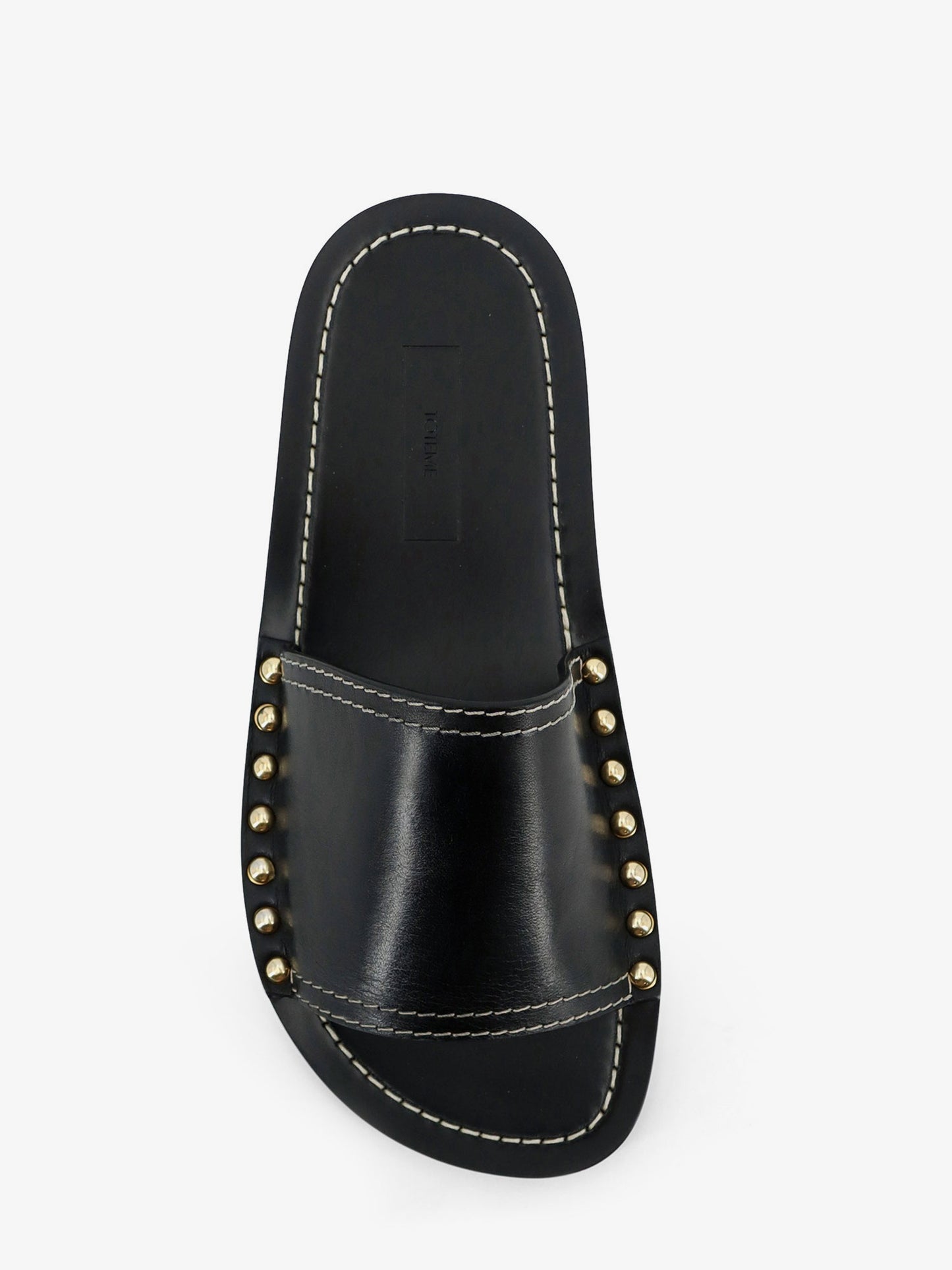 Low leather sandals with metal studs on the sides