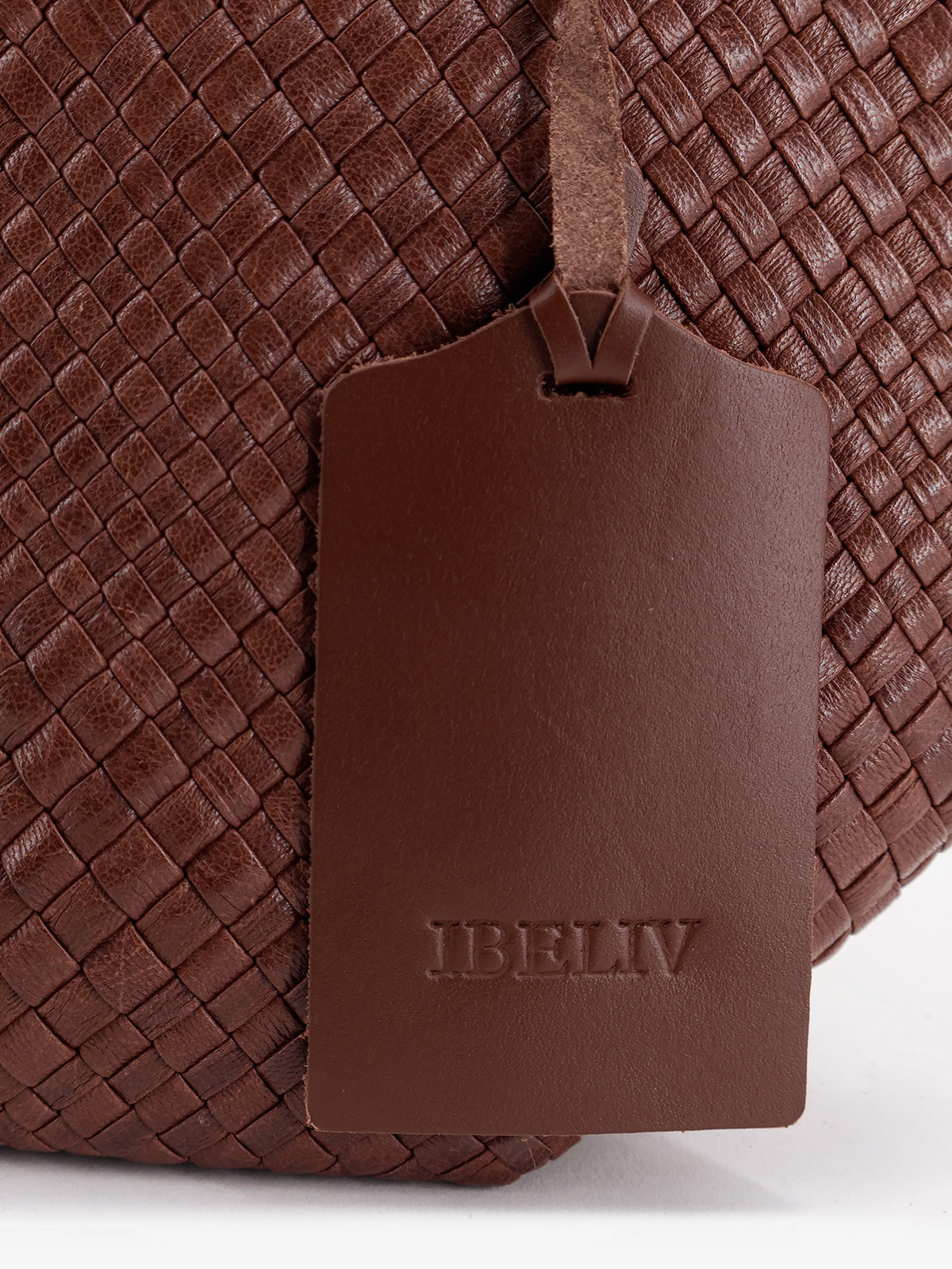 Trinity Medium vegetable-tanned leather shoulder bag with a woven pattern