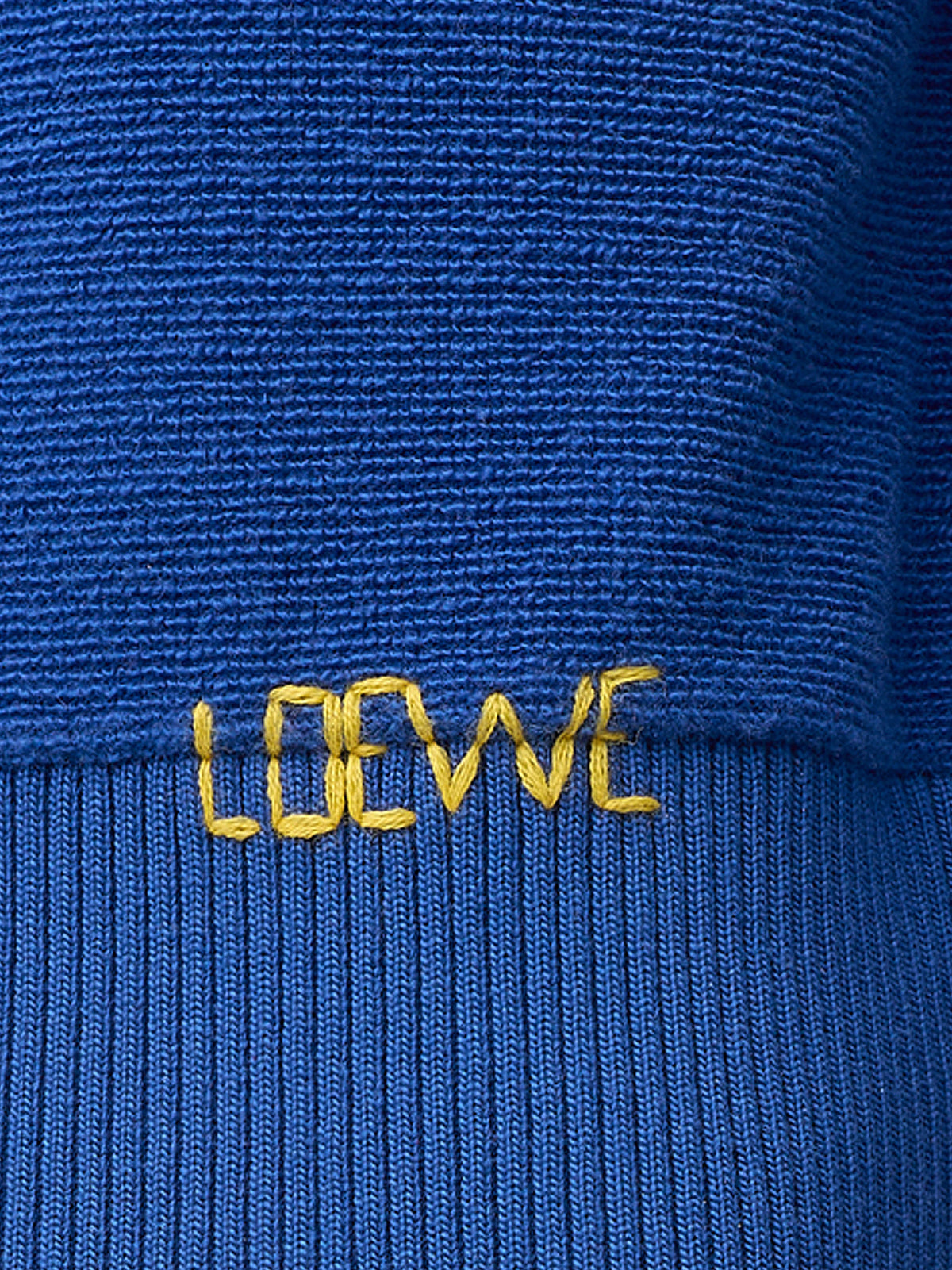 Wool sweater with contrasting embroidered logo at the bottom