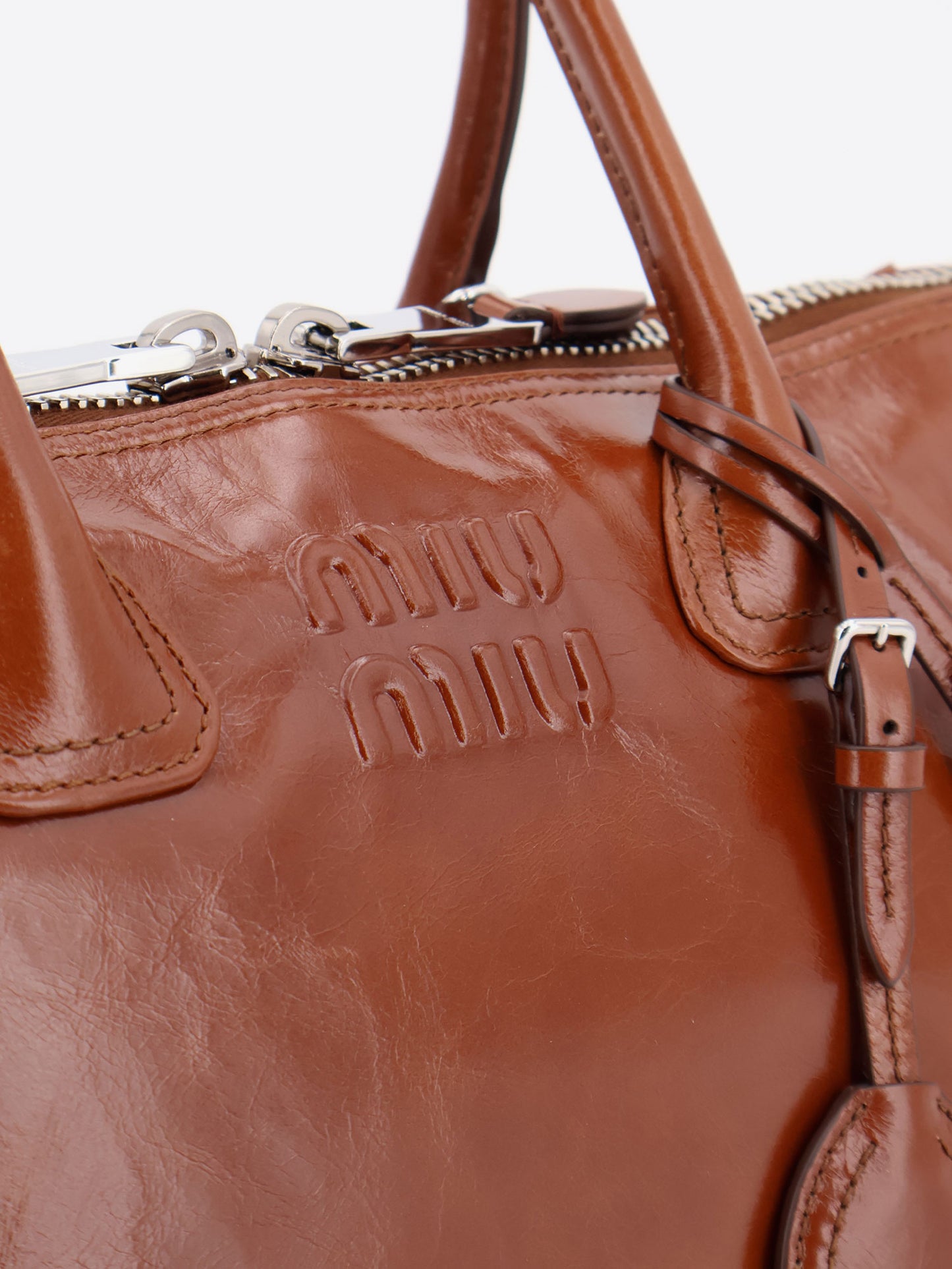 Shiny leather handbag with front lettering logo