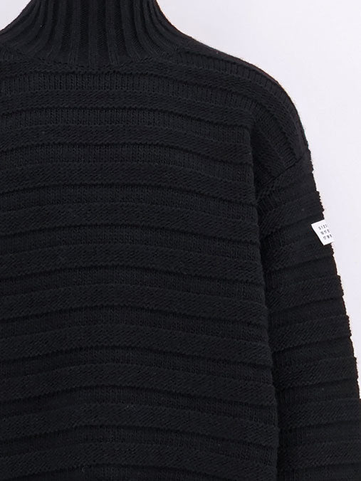 Wool blend sweater with distressed effect