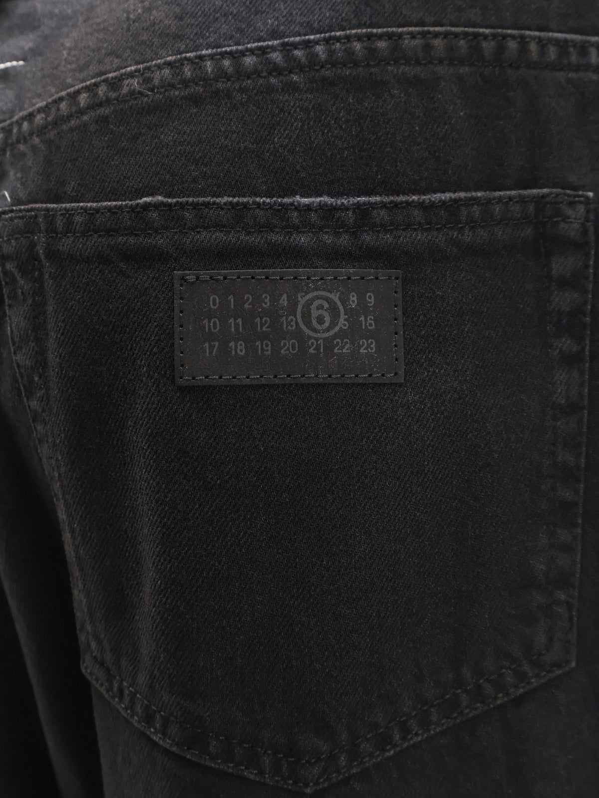 Black denim trousers