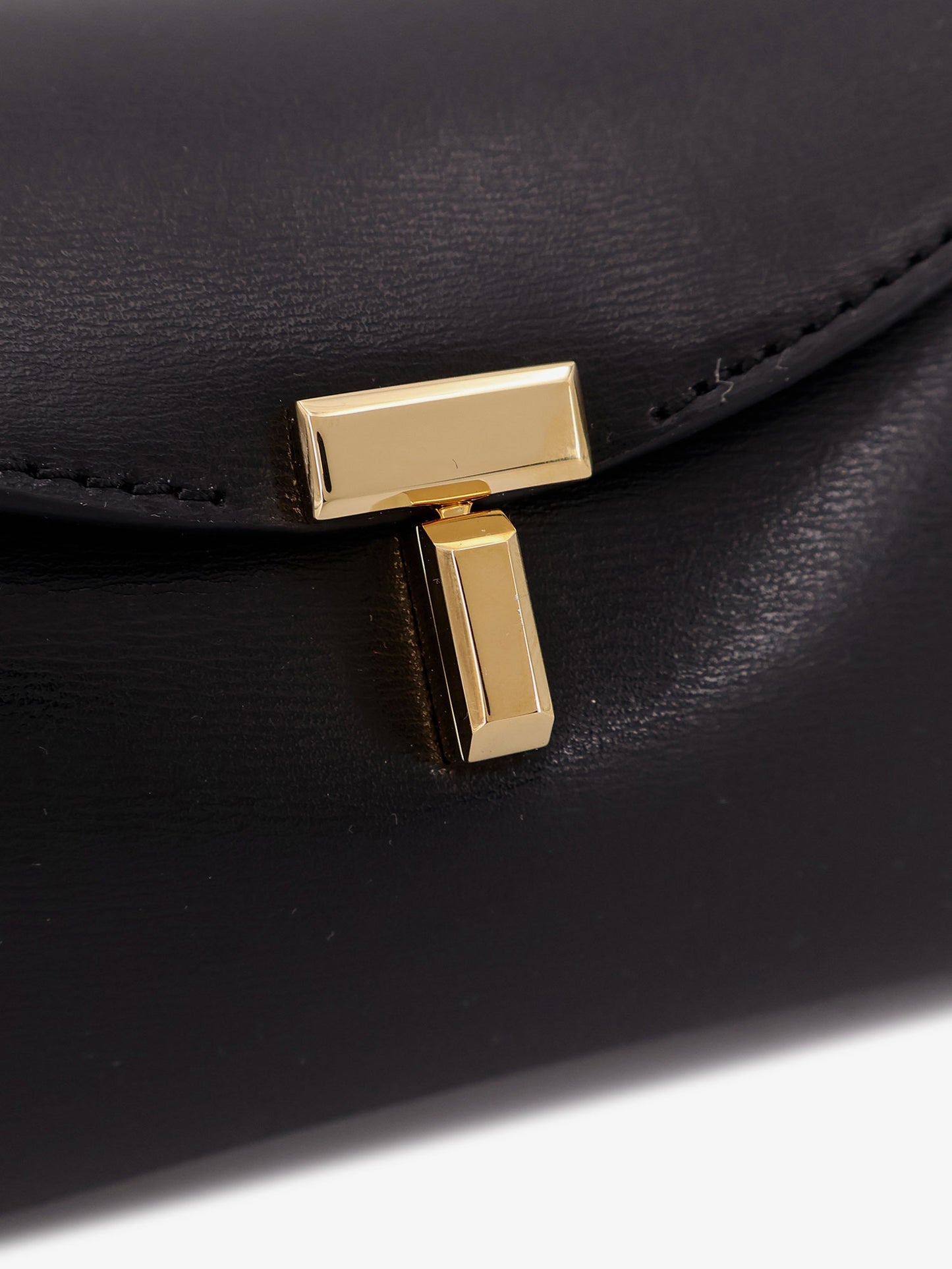 Mini T-Lock leather clutch
