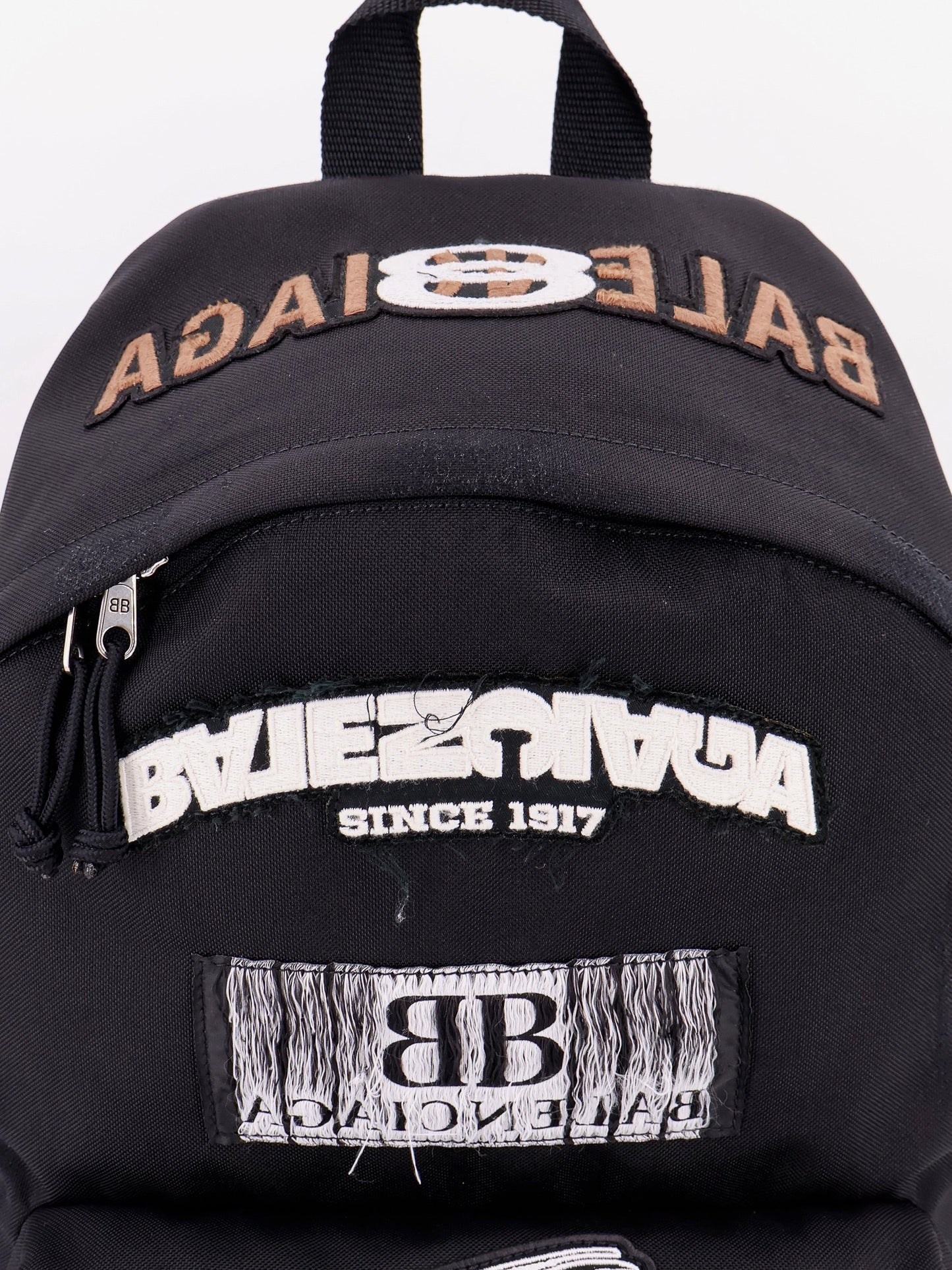 Used effect nylon backpack with printed logo on the front