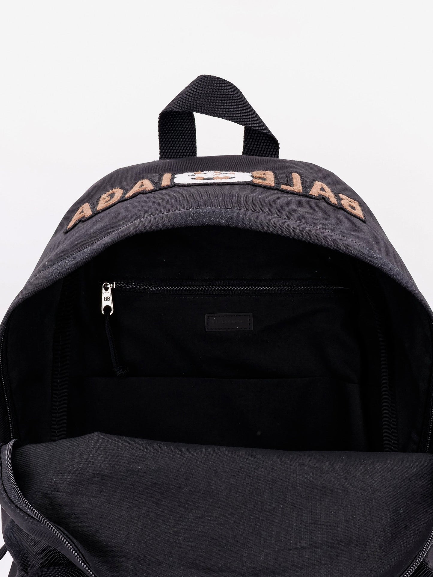 Used effect nylon backpack with printed logo on the front