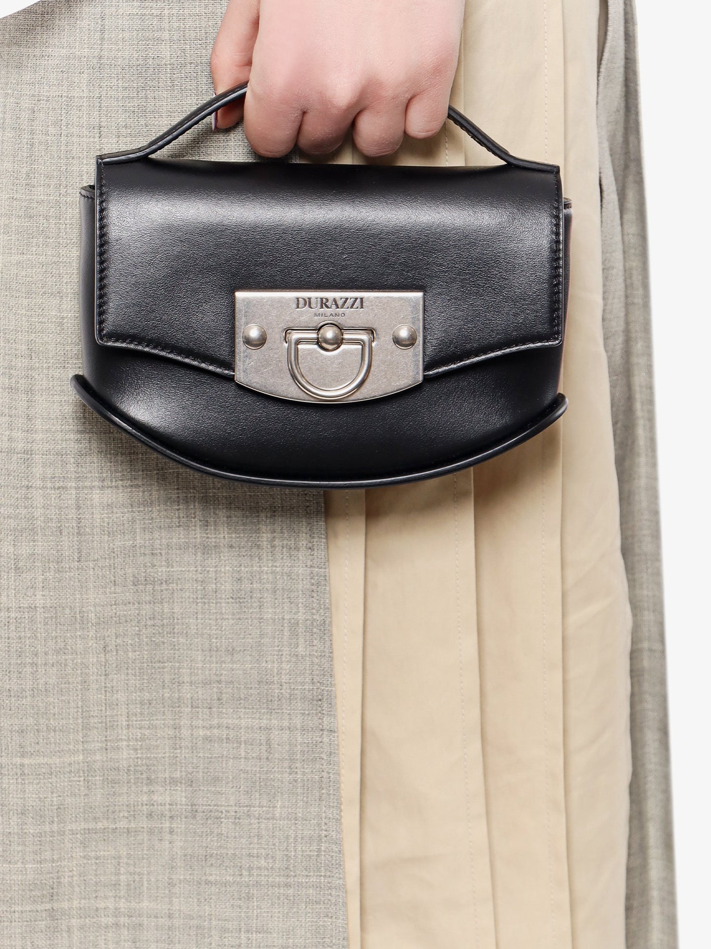 Leather handbag with engraved logo