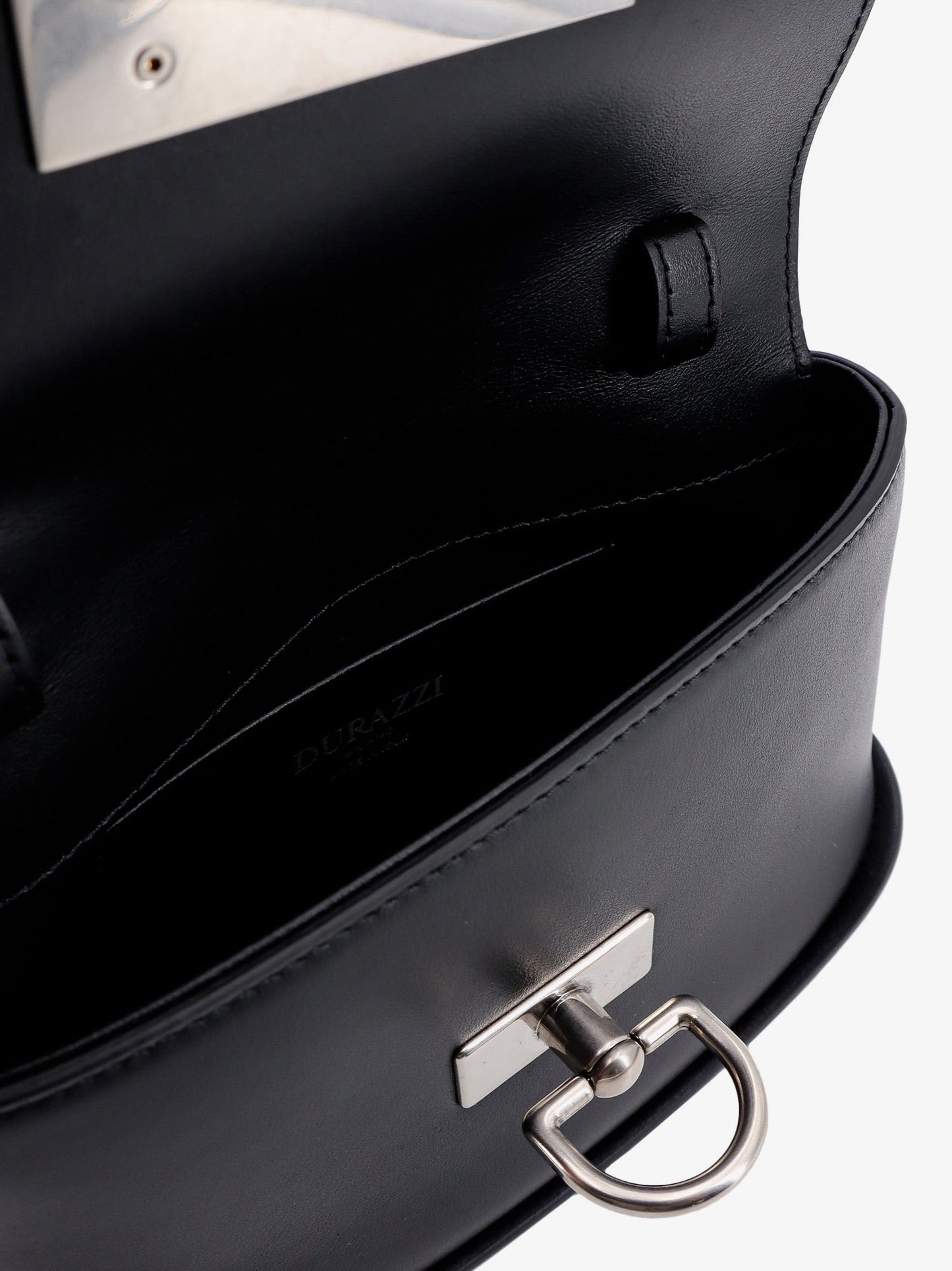 Leather handbag with engraved logo