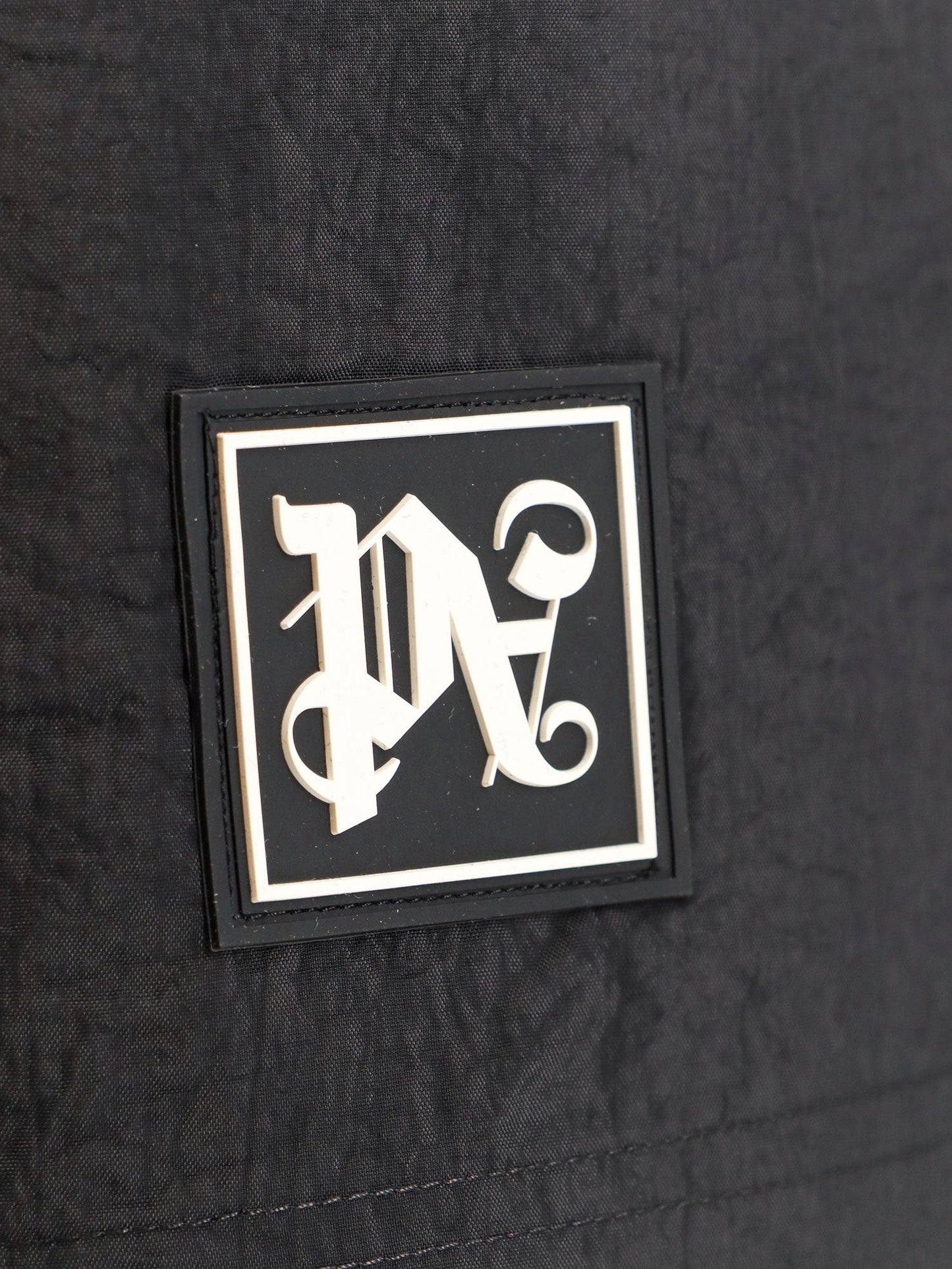 Nylon swim shorts with logo patch on the bottom