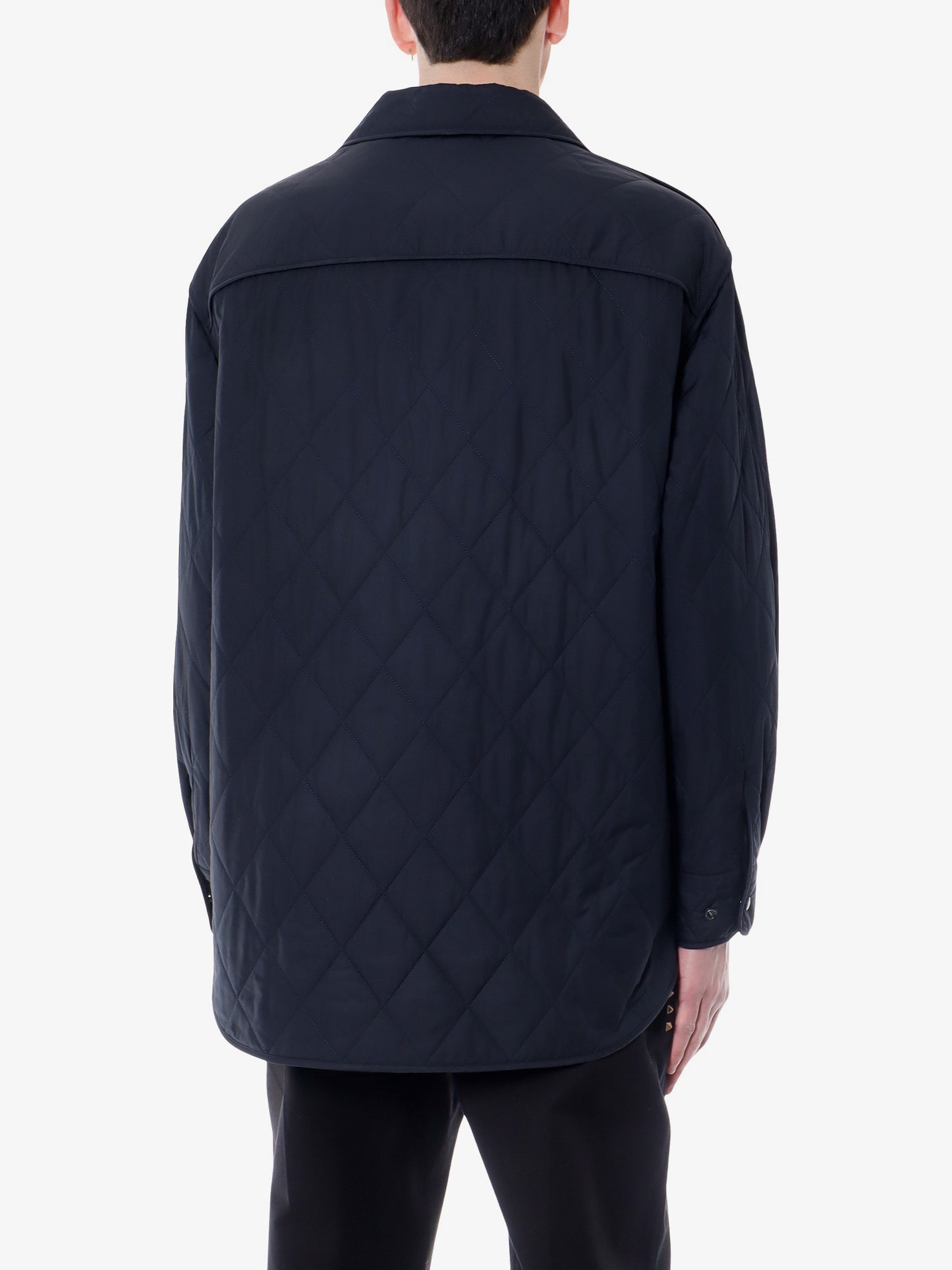 Padded and quilted nylon jacket with iconic studs