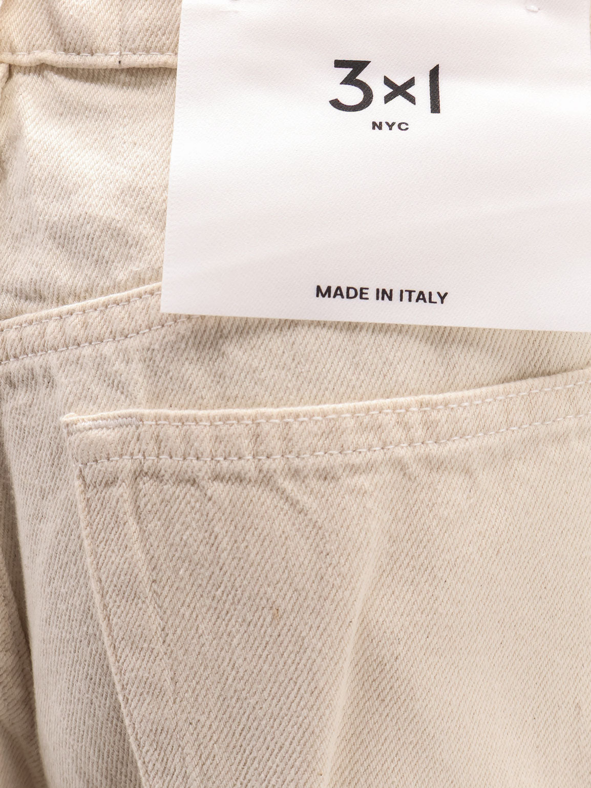 Flip Cuffed cream denim trousers