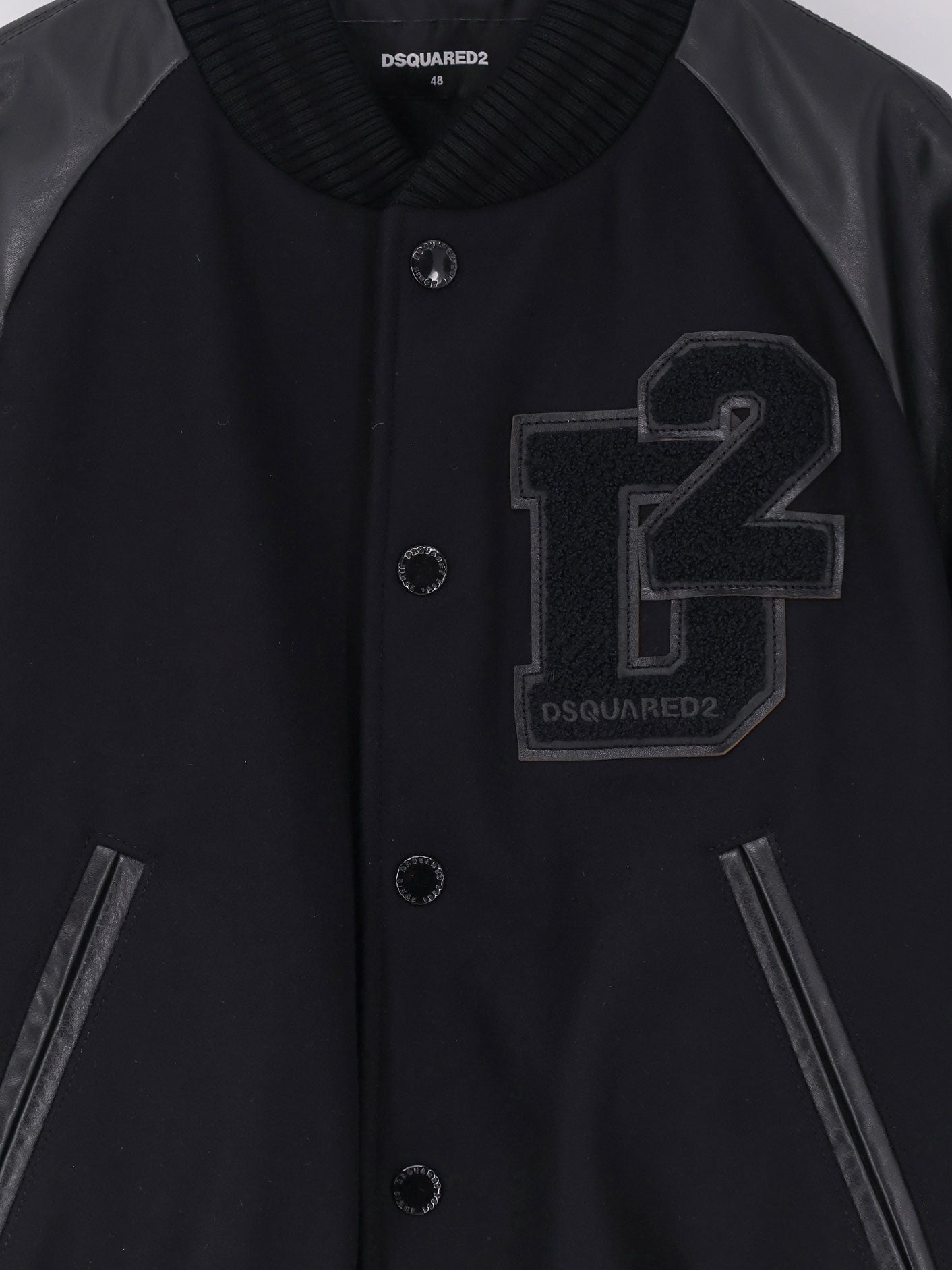 Wool jacket with leather sleeves