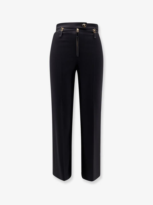Trousers with logoed button