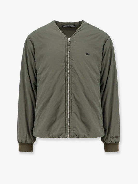 Nylon jacket with metal logo patch on the front