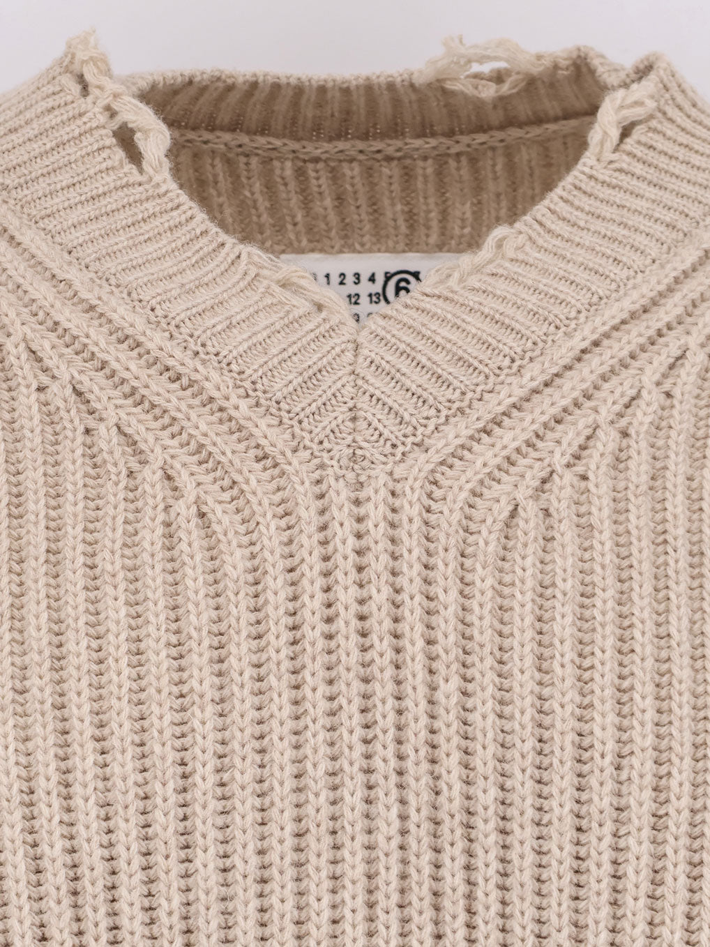 Wool blend sweater with distressed effect