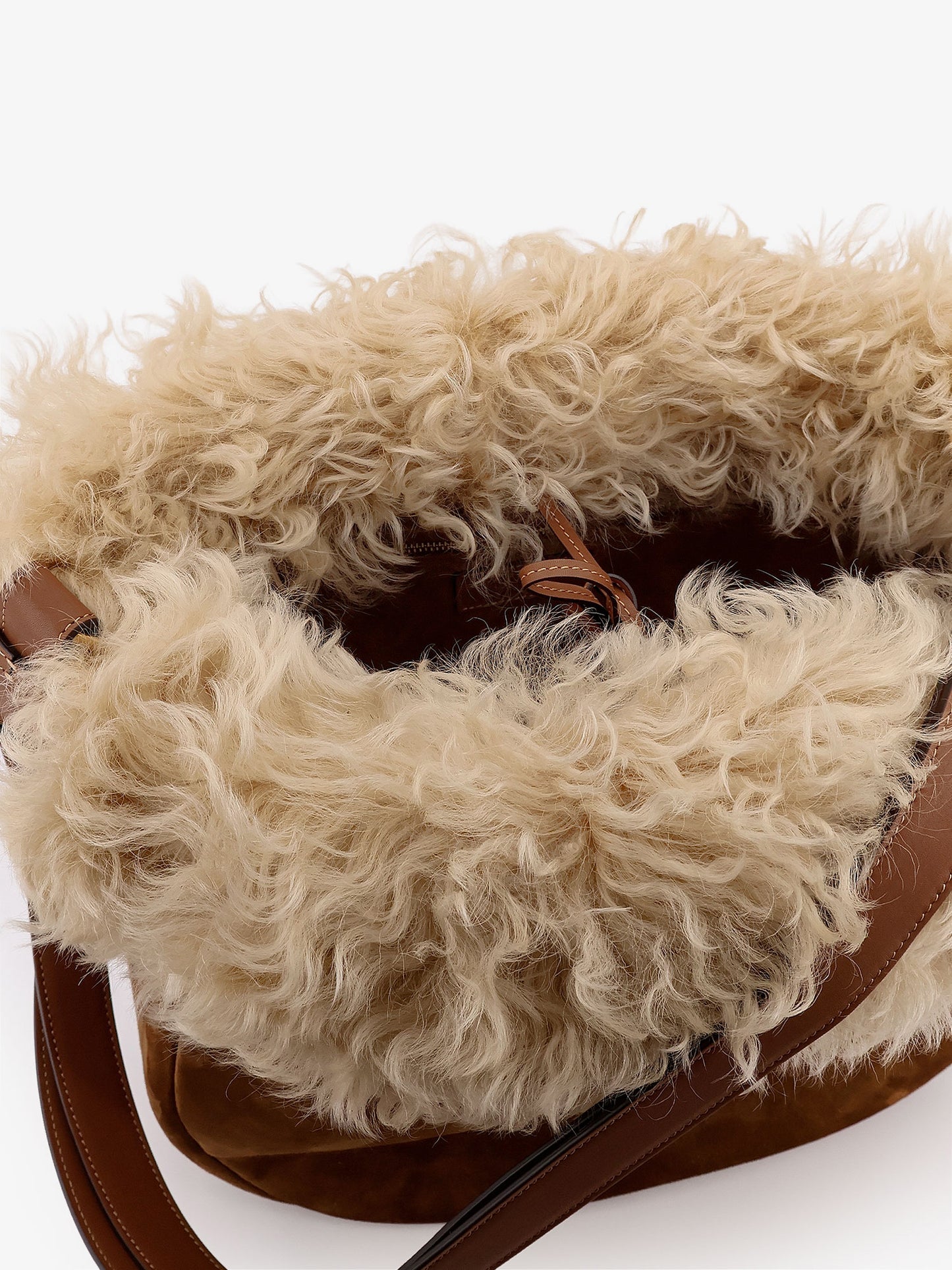 Suede shoulder bag with shearling profile