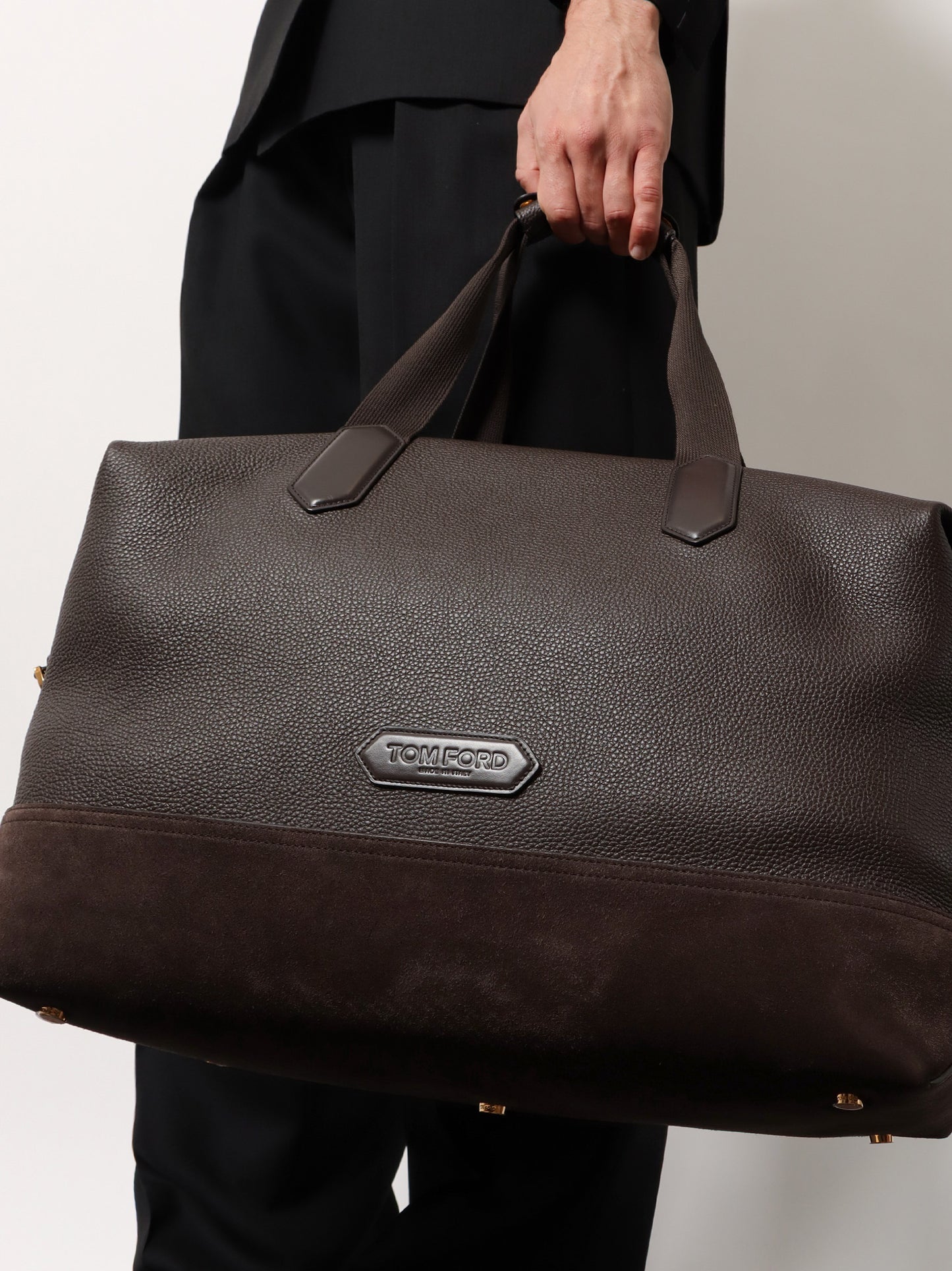 Leather travel bag with suede inserts