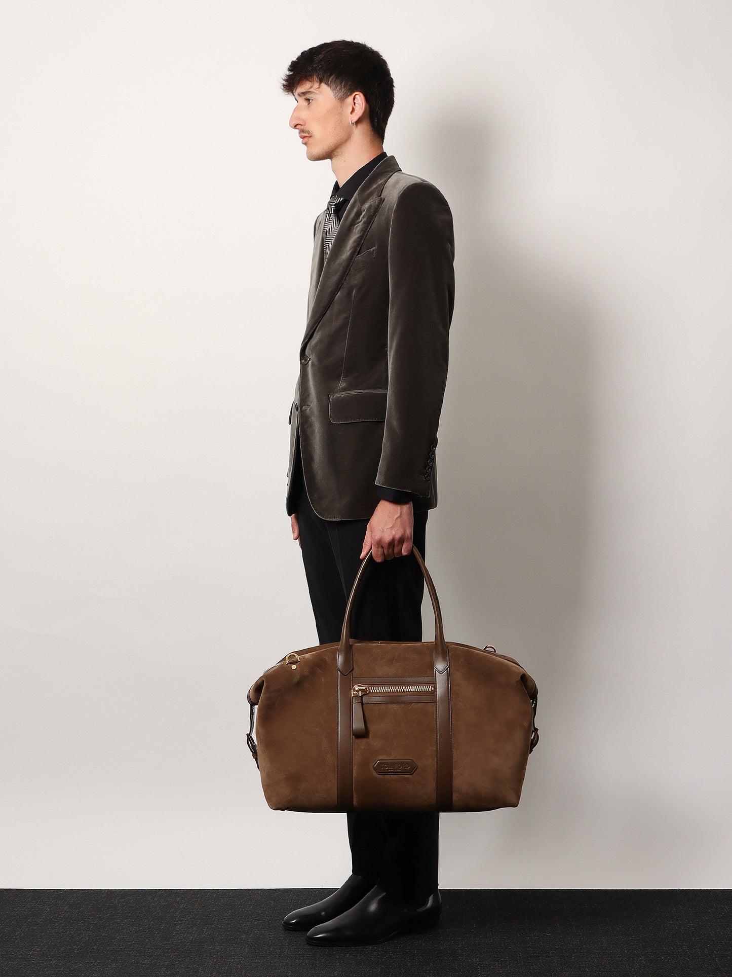 Suede travel bag with leather inserts