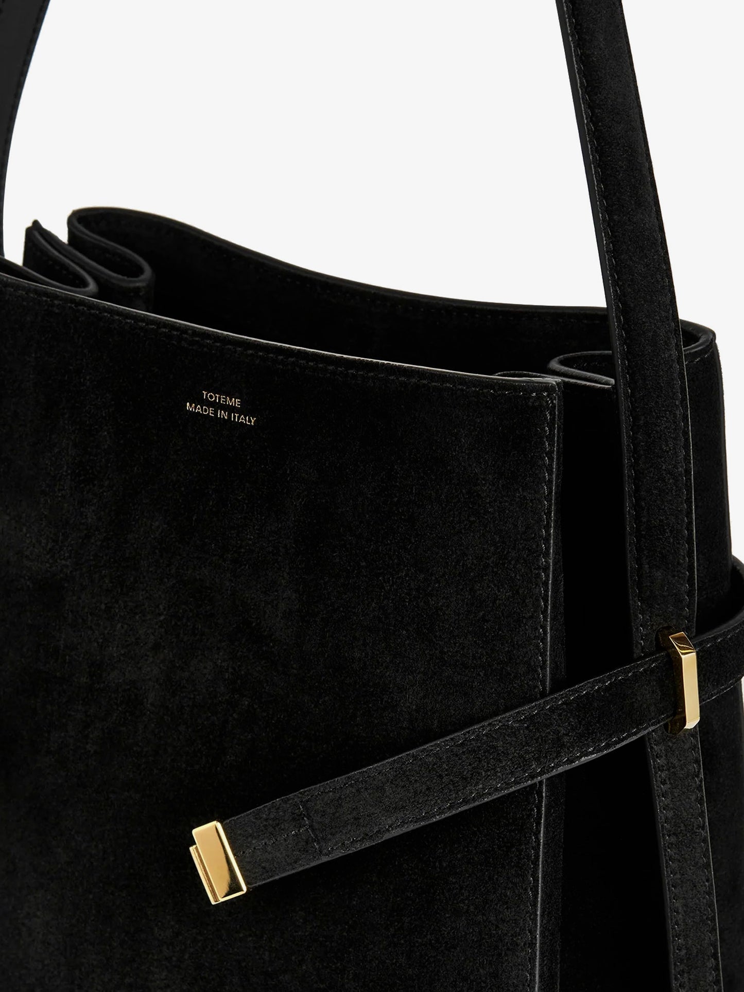 Suede shoulder bag with metal detail on the front
