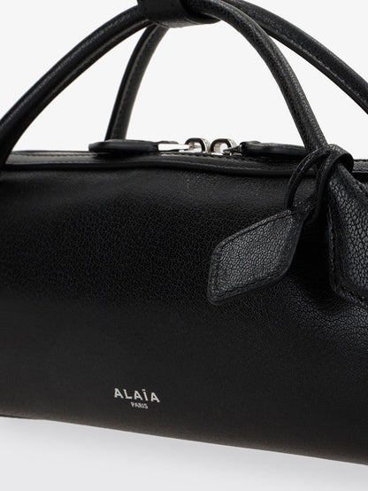 Le Teckel suede clutch bag thumbnail