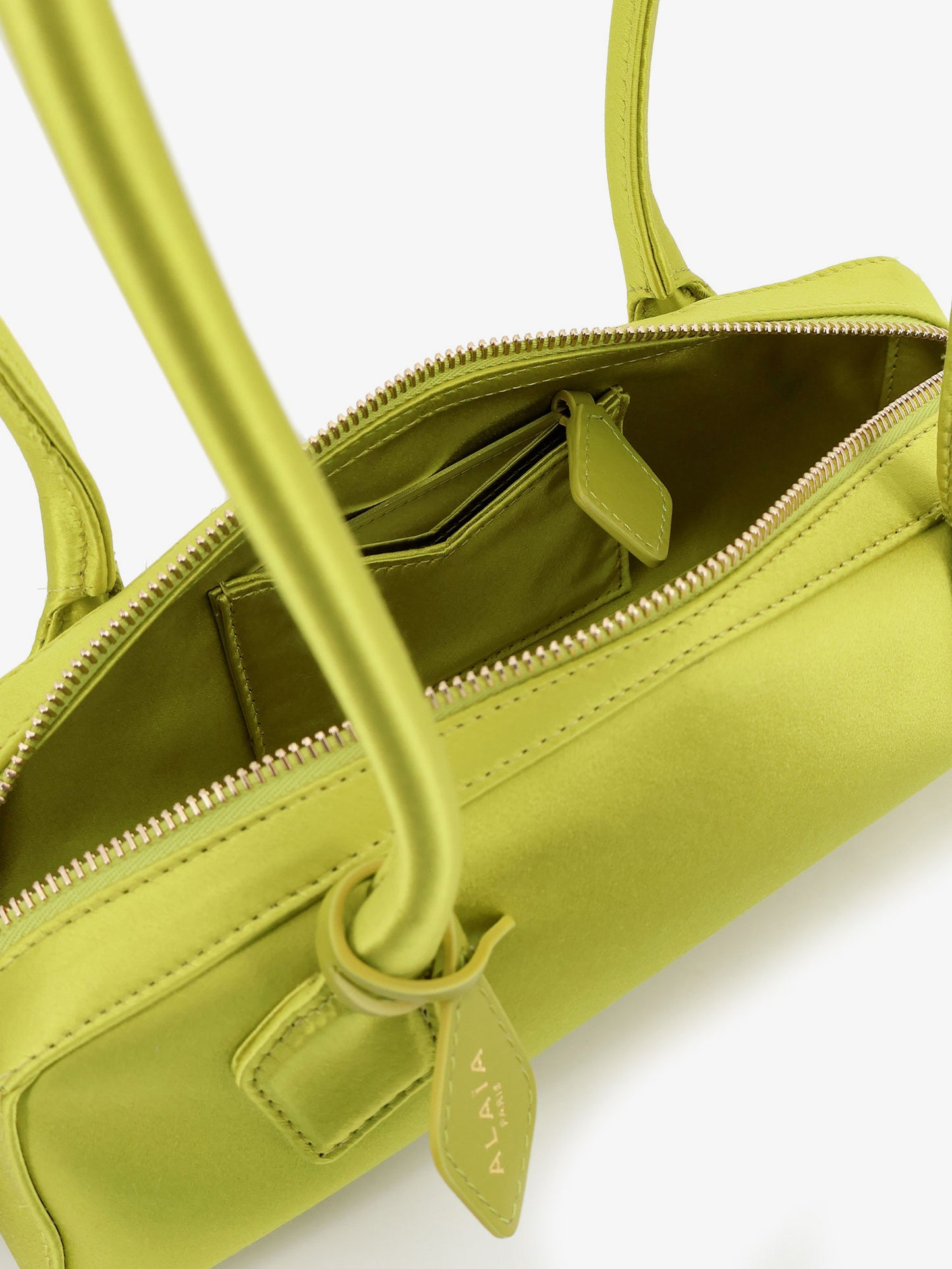 Le Teckel satin shoulder bag with front logo