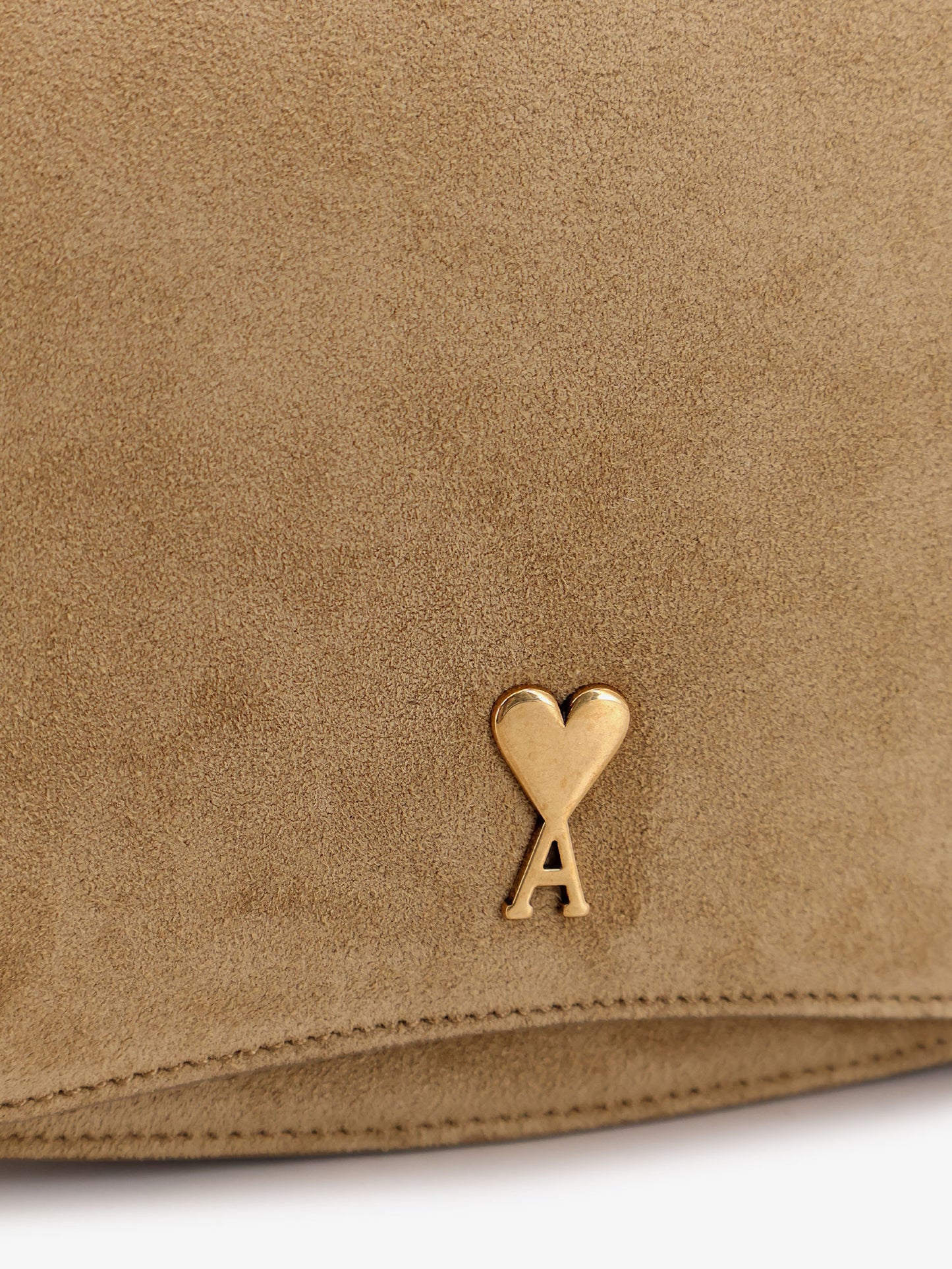 Suede shoulder bag with metal logo on the front