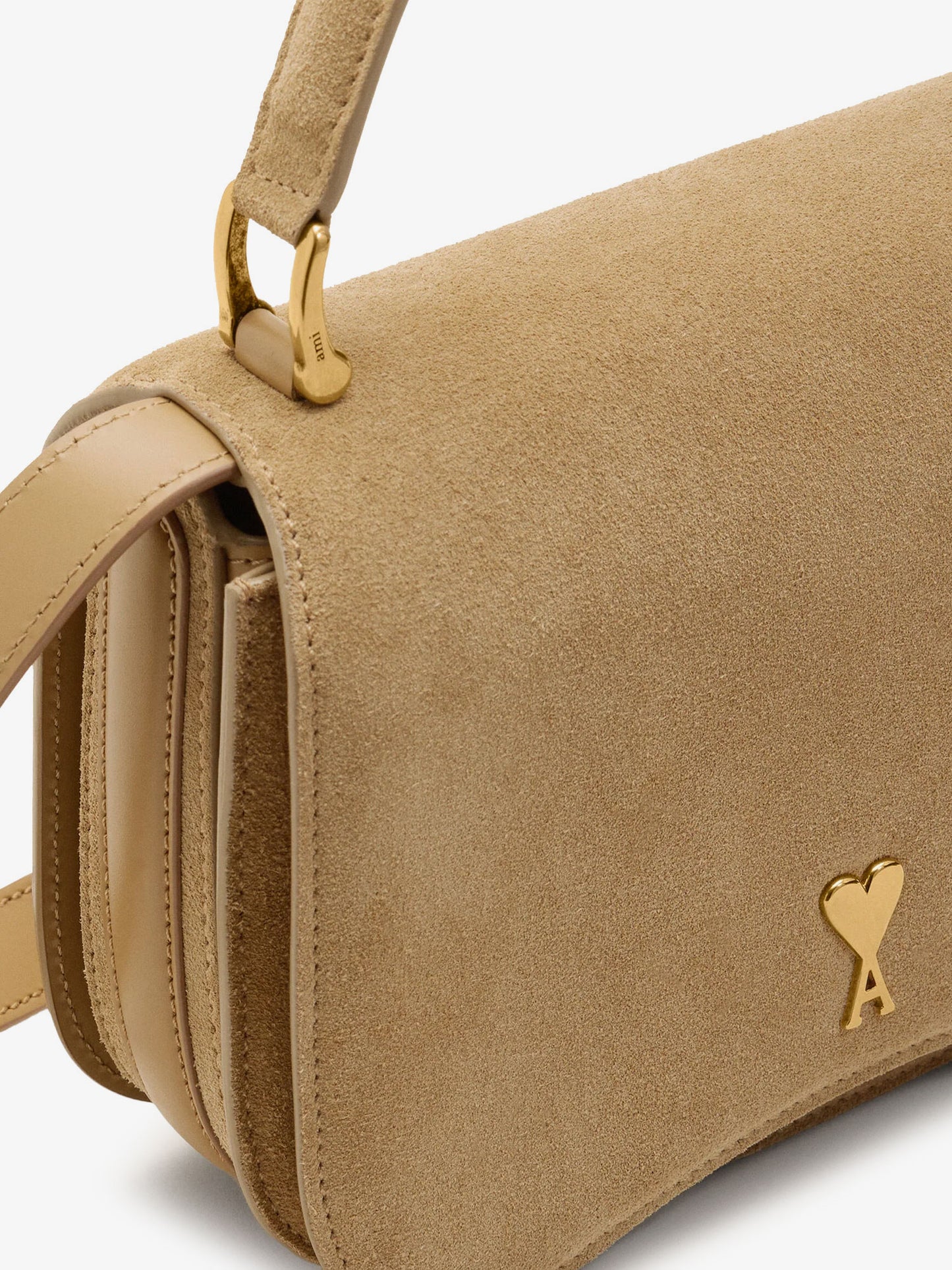 Suede crossbody bag with metal logo on the front