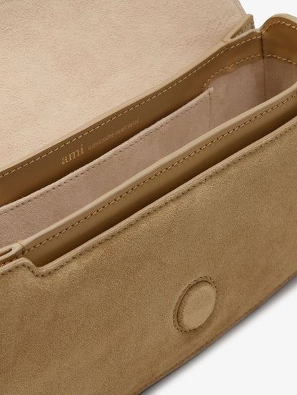 Suede shoulder bag with logo on the front thumbnail