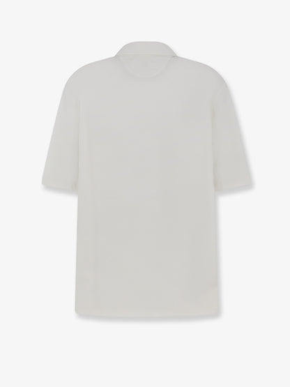 Virgin wool polo shirt with front logo patch thumbnail
