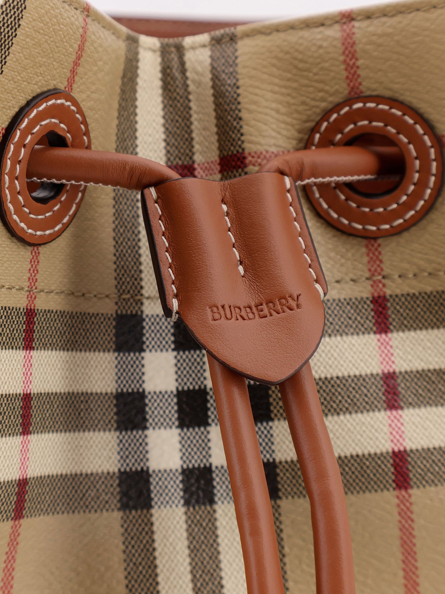 Coated canvas bucket bag with check pattern