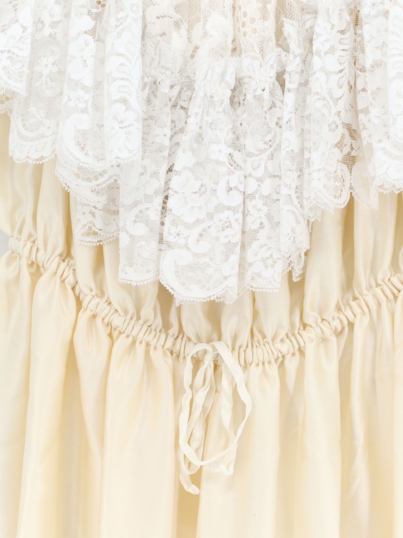 Silk jumpsuit with lace ruffles