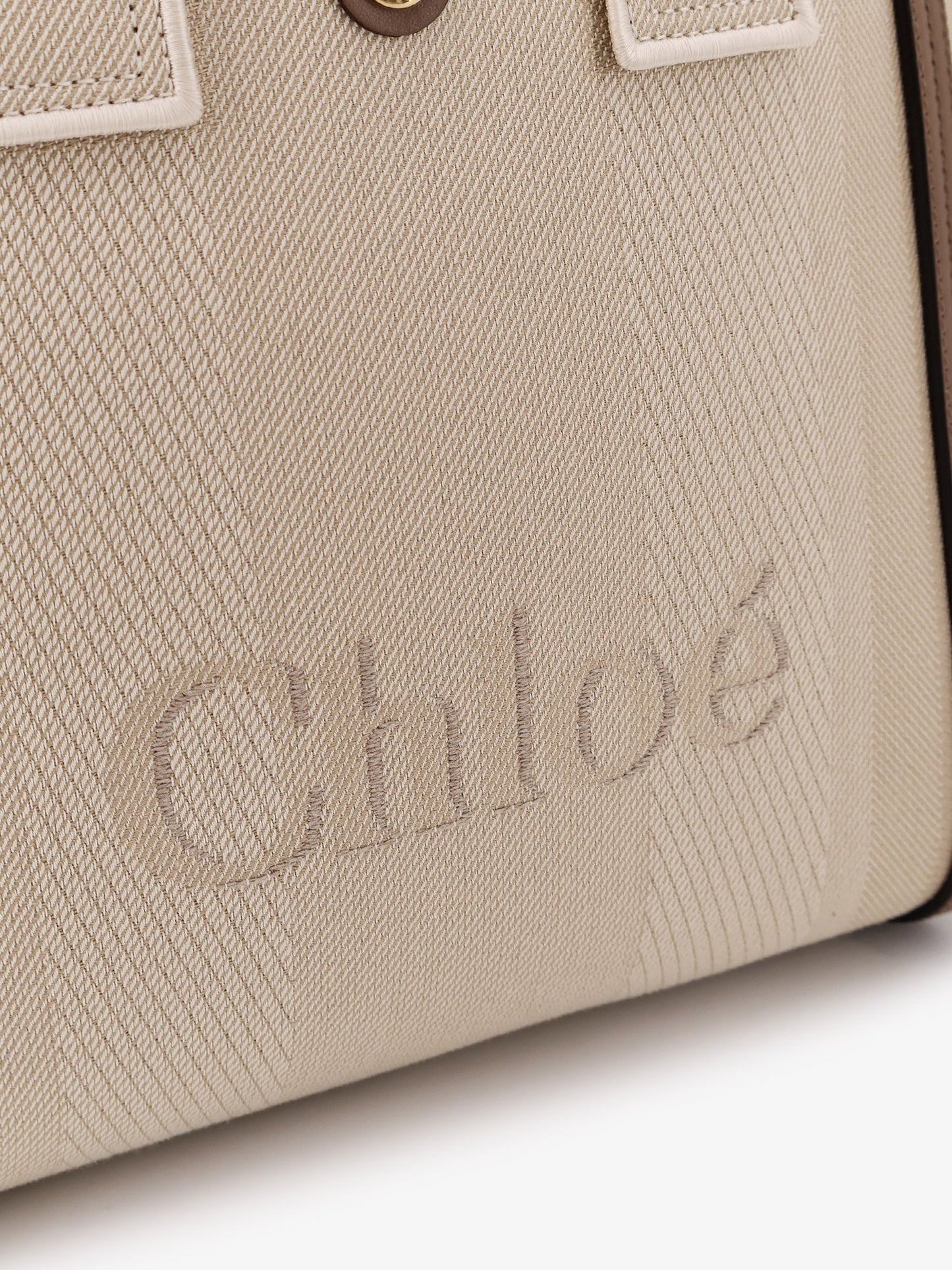 Chloé Carry canvas crossbody bag with oversized logo on the front