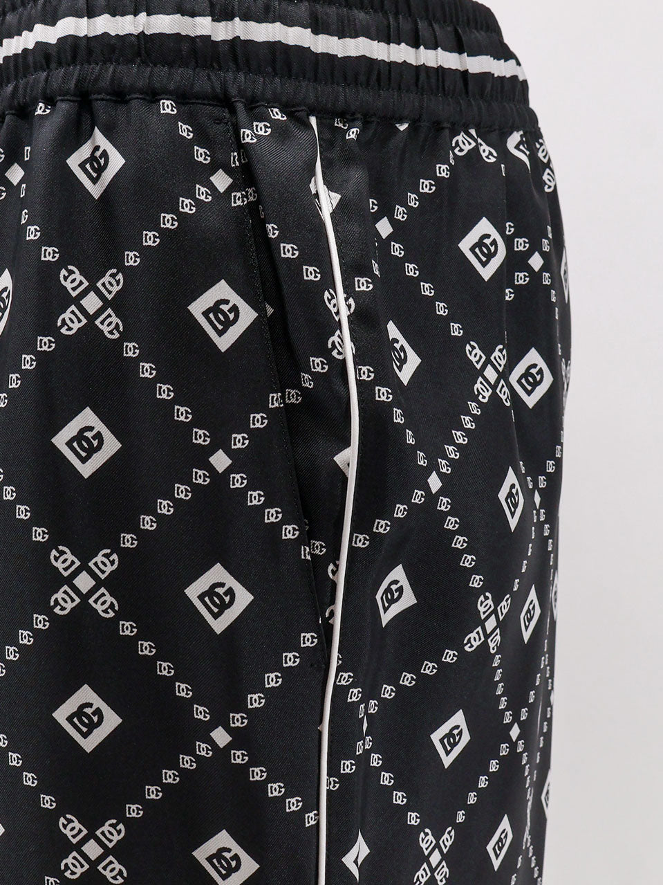Silk trousers with all-over logo print