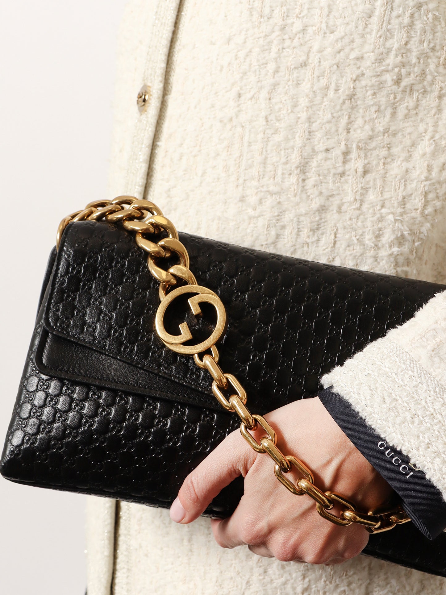 Leather crossbody bag with embossed GG motif