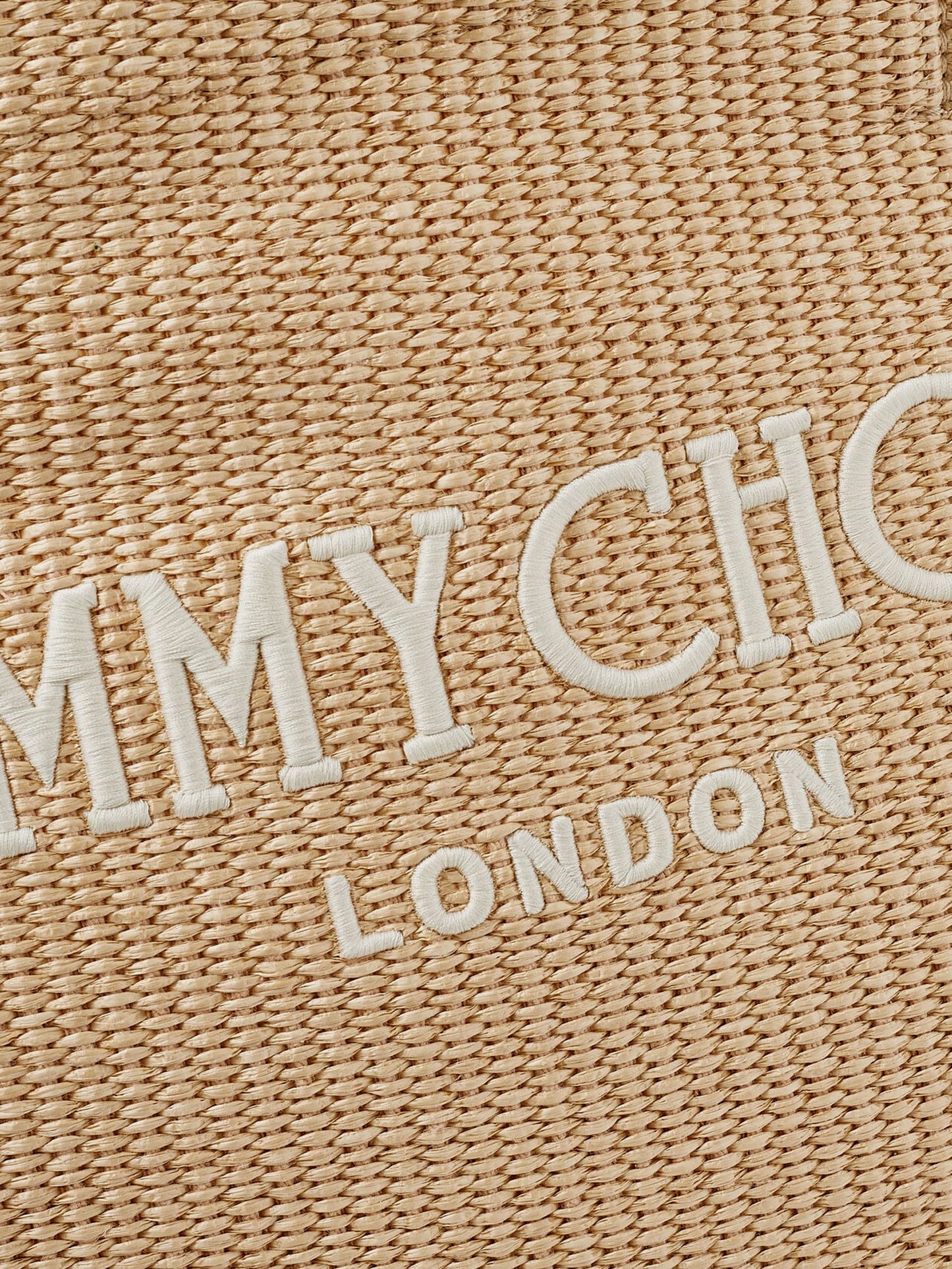 Raffia shopping bag with lettering logo on the front